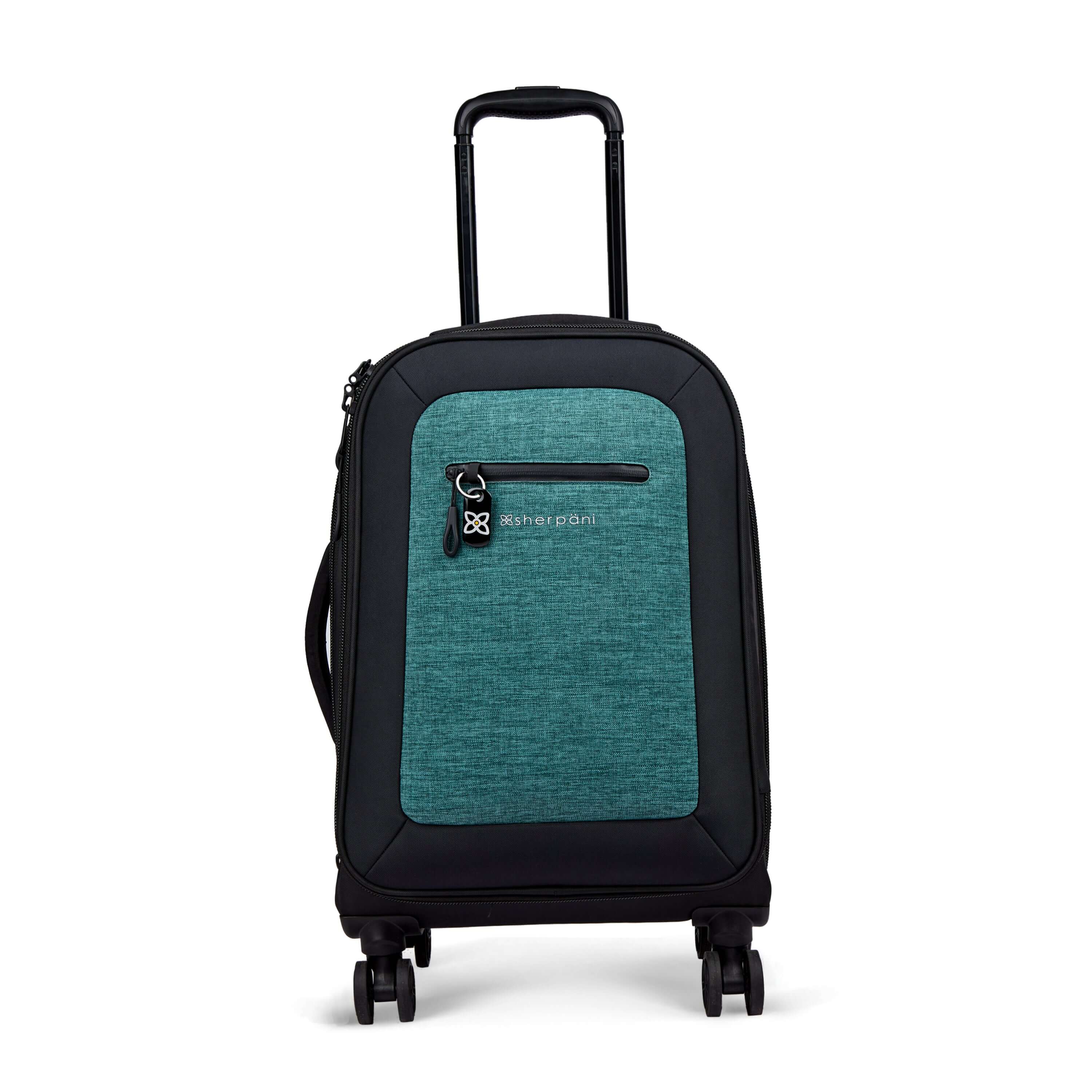 Flat front view of Sherpani’s Anti-Theft luggage the Latitude in Teal. The suitcase has a soft shell exterior made from recycled plastic bottles and features vegan leather accents in black. There is a main zipper compartment, an expansion zipper and an external pocket on the front with a locking zipper and a ReturnMe tag. On the top of the suitcase sits a retractable luggage handle. On the side sits an easy-access handle. At the bottom are four 360-degree spinner wheels for smooth rolling. 