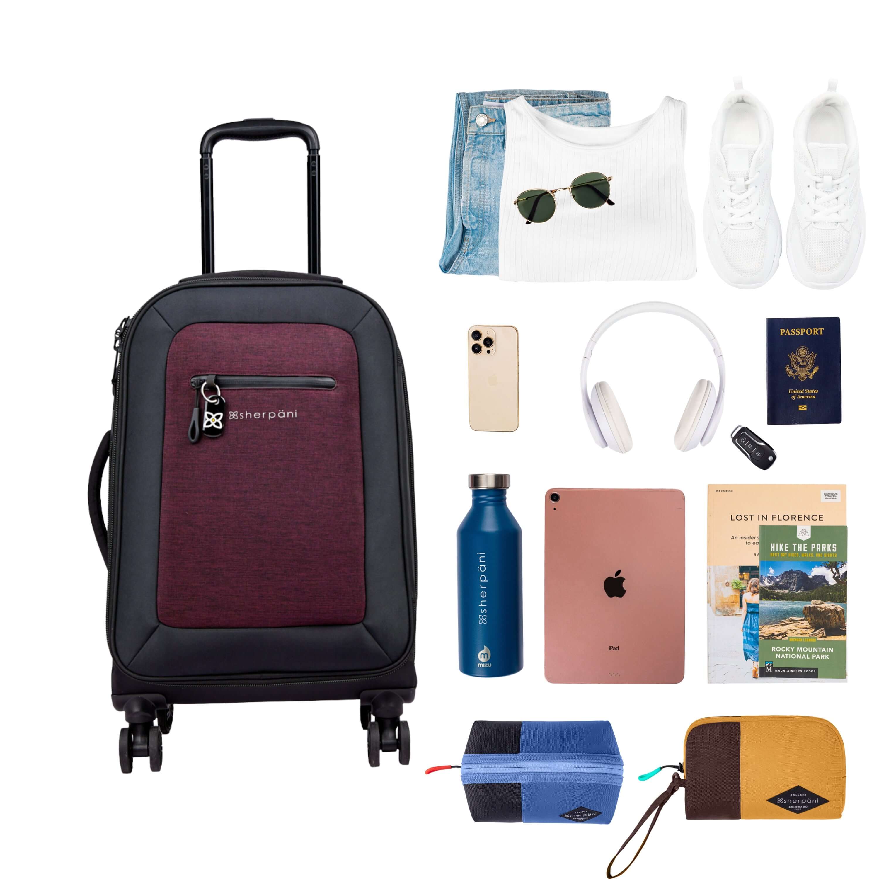 Top view of example items to fill the suitcase. On the left lies Sherpani’s Anti-Theft luggage, the Latitude in Merlot. On the right lies an assortment of items: change of clothes, sunglasses, sneakers, phone, headphones, car key, passport, water bottle, tablet, travel books and Sherpani travel accessories the Harmony in Pacific Blue and the Jolie in Sundial.