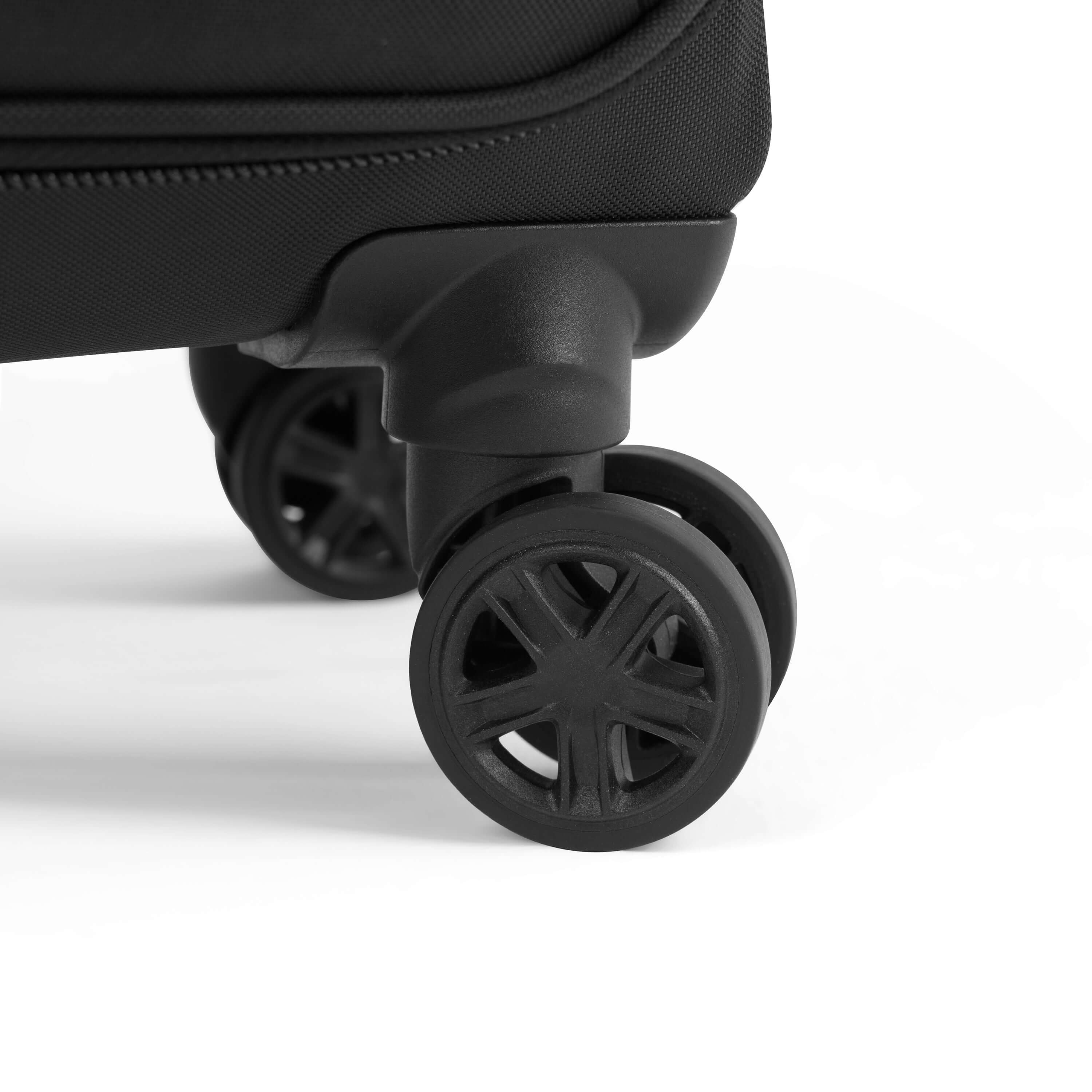 Close up view of rolling luggage wheels on Sherpani&#39;s Anti-Theft suitcase the Latitude in Sterling.