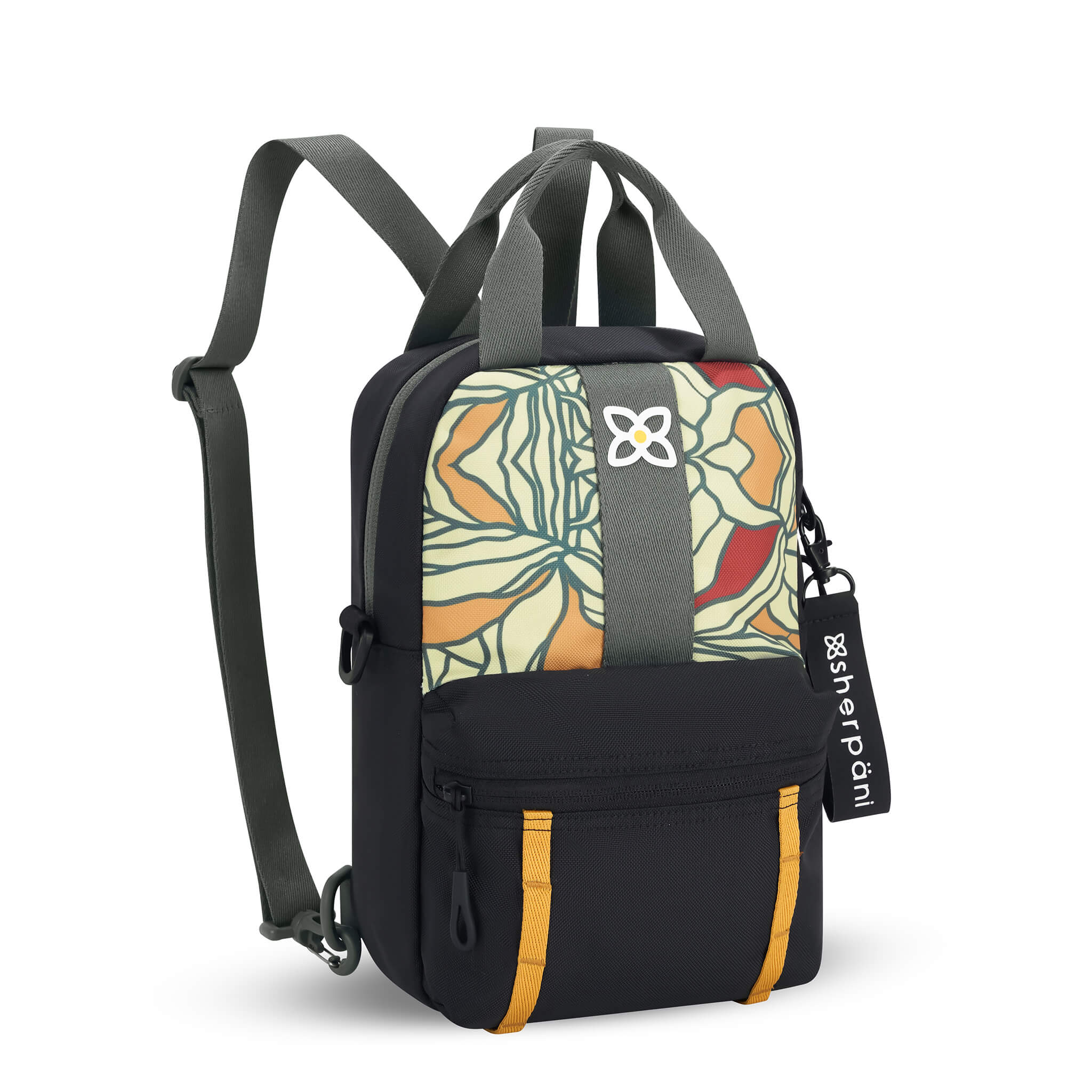Angled front view of Sherpani mini backpack the Logan in Fiori. The bag is black and gray with an accented daisy chain in yellow. The front panel features a multi-colored floral pattern. The Logan has fixed tote handles and adjustable backpack straps. 