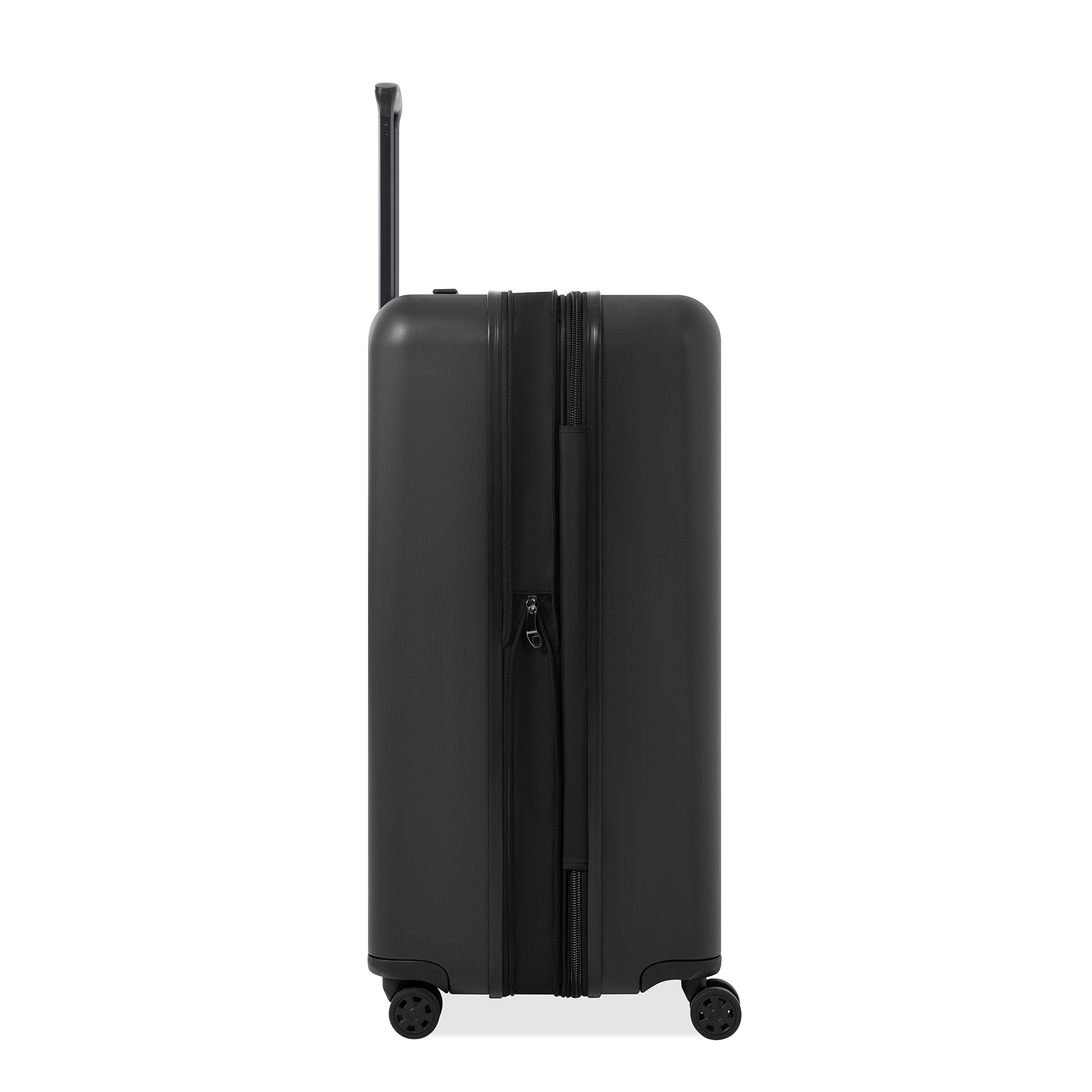 Side view of Sherpani hard-shell carry-on luggage, the Meridian in Black. Meridian features include a retractable luggage handle, uncrushable exterior, TSA-approved locking zippers and four 36-degree spinner wheels. 