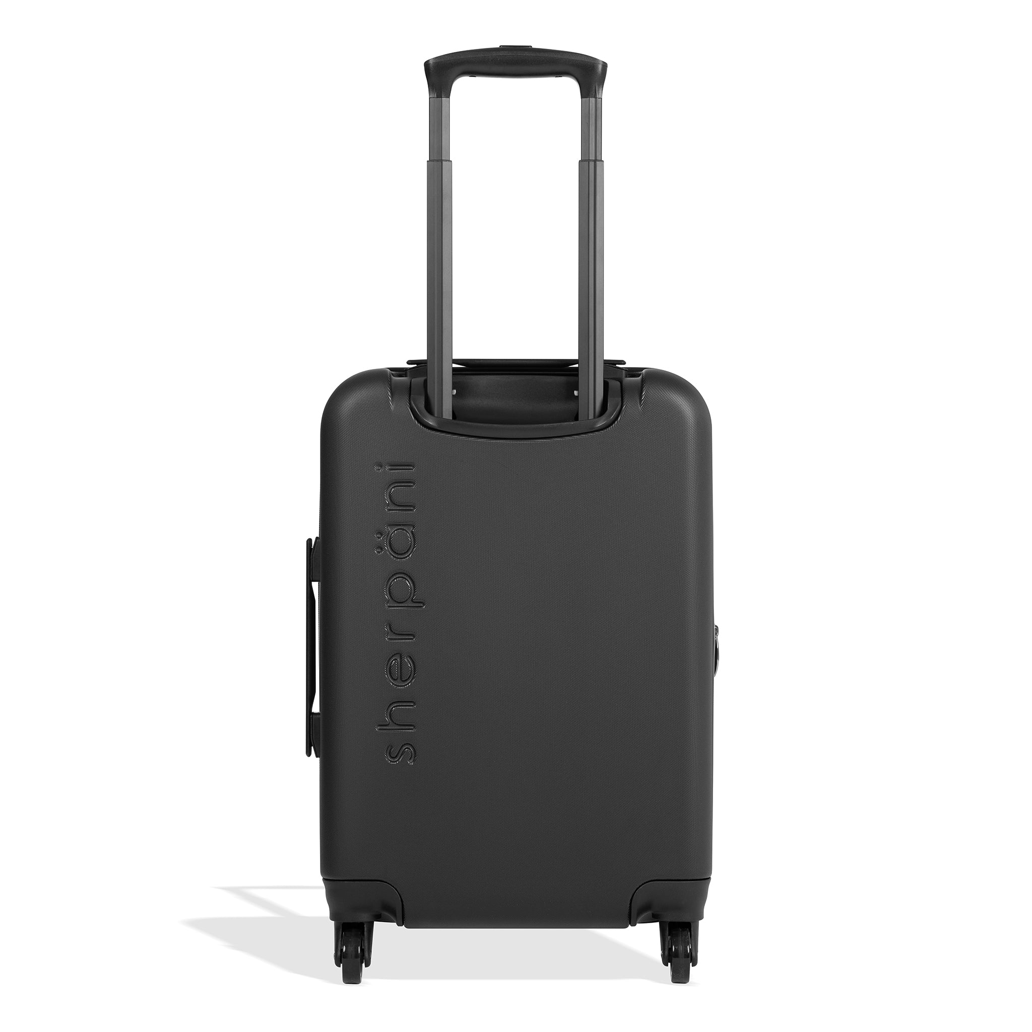 Back view of Sherpani hard-shell carry-on luggage, the Meridian in Bluff. Meridian features include a retractable luggage handle, uncrushable exterior, TSA-approved locking zippers and four 36-degree spinner wheels. The Bluff colorway is two-toned with the front of the suitcase in bluff and the back in classic black. 