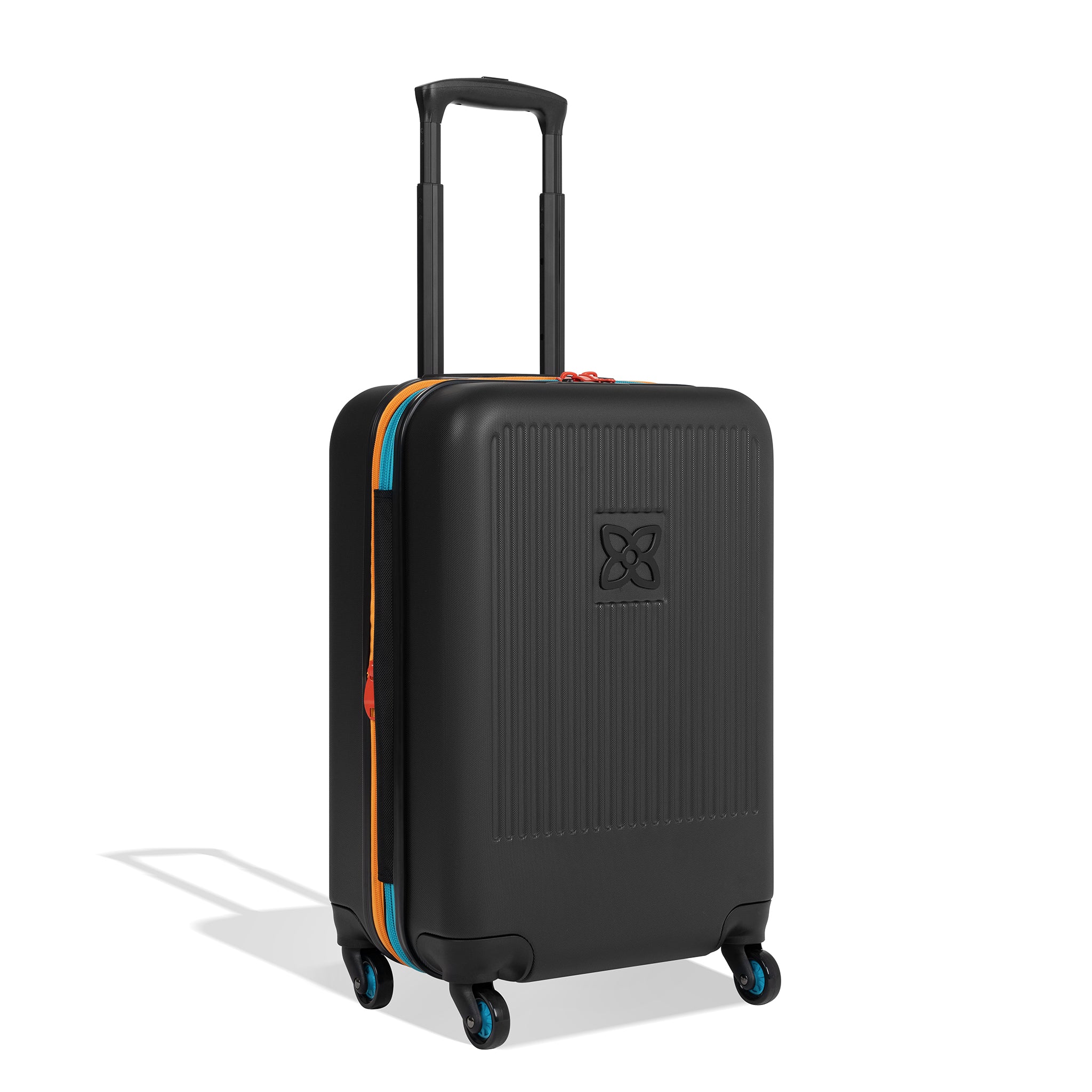 Angled front view of Sherpani hard-shell carry-on luggage, the Meridian in Chromatic. Meridian features include a retractable luggage handle, uncrushable exterior, TSA-approved locking zippers and four 36-degree spinner wheels. Chromatic color is primarily black with pops of color in red, yellow and blue. #color_chromatic