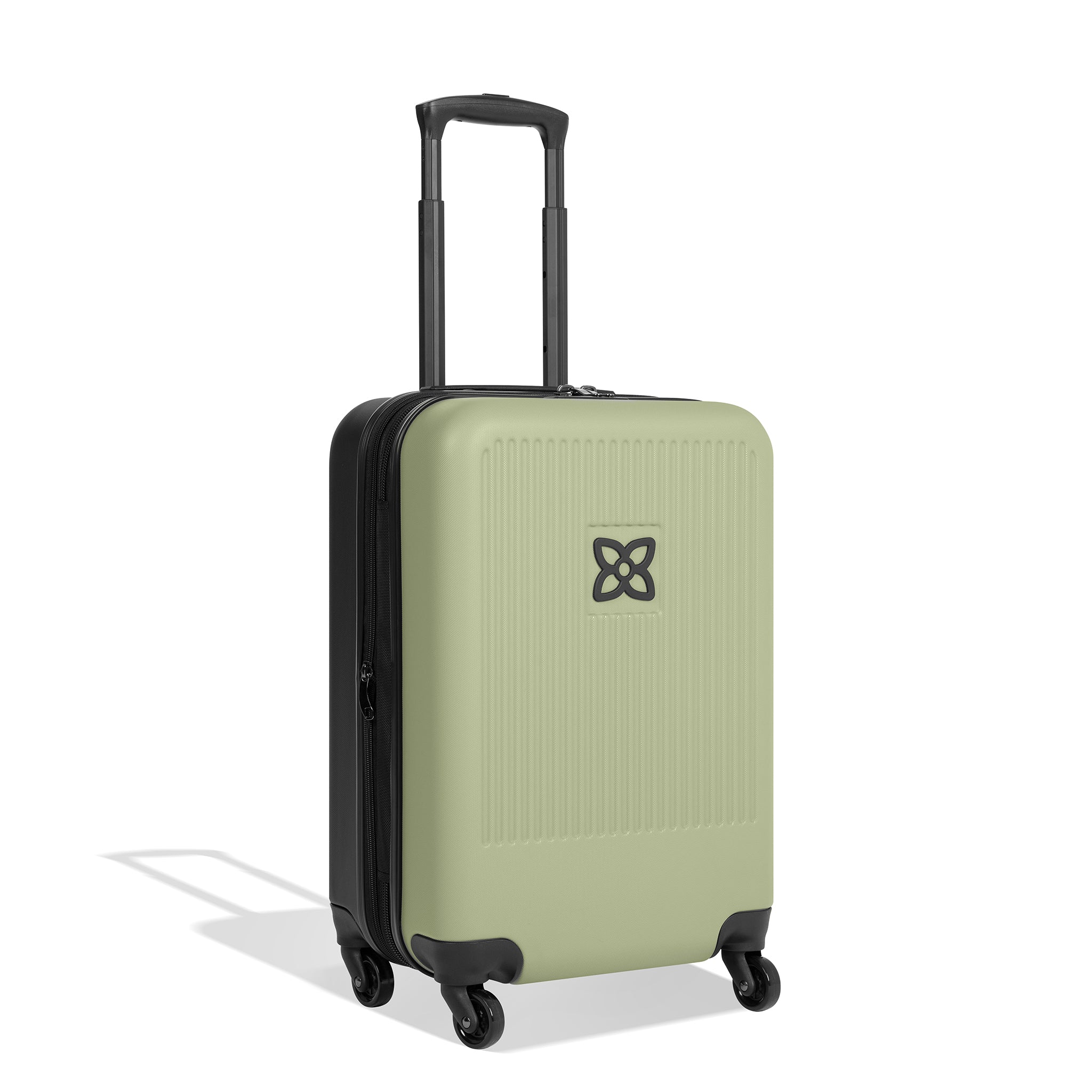 Angled front view of Sherpani hard-shell carry-on luggage, the Meridian in Sage. Meridian features include a retractable luggage handle, uncrushable exterior, TSA-approved locking zippers and four 36-degree spinner wheels. The Sage color is two-toned with the front of the suitcase in sage green and the back in classic black. 