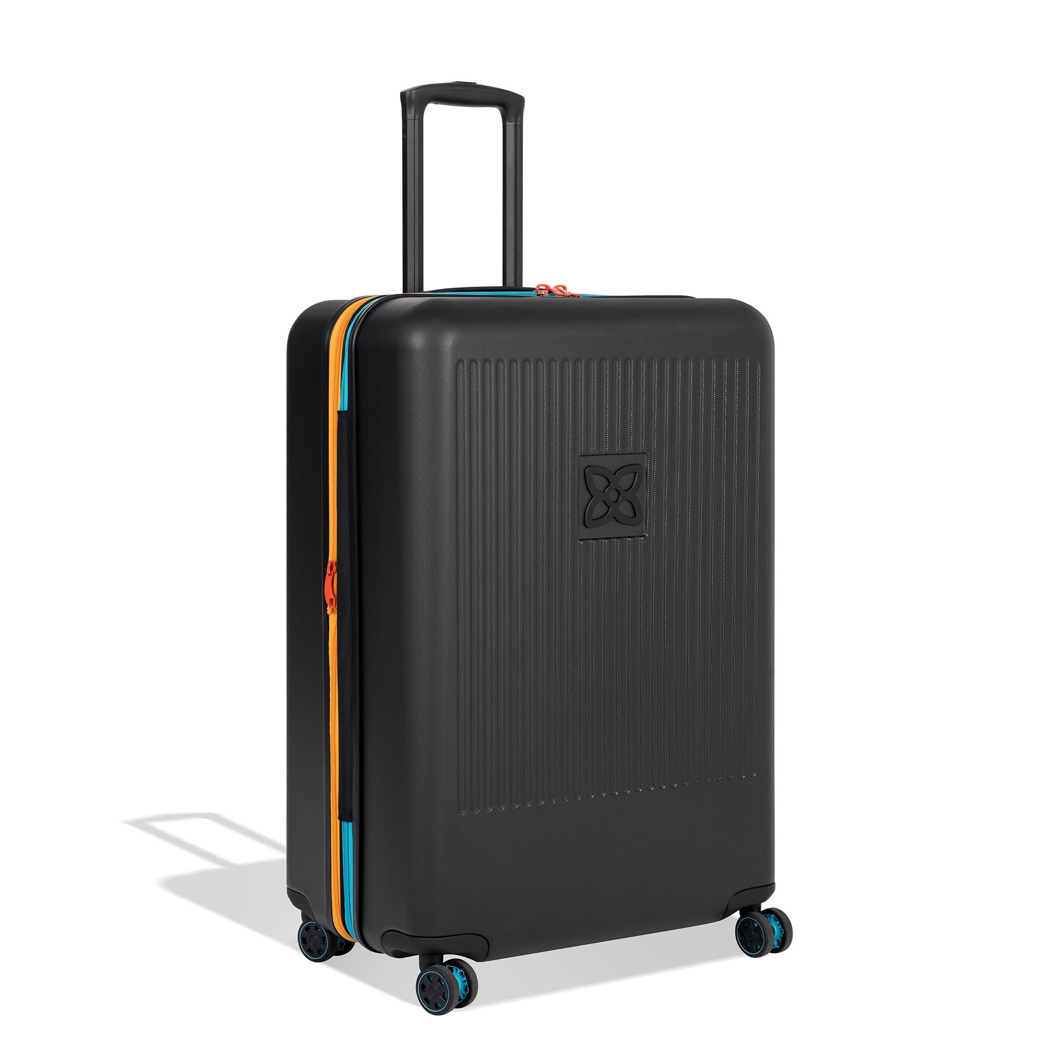 Angled front view of Sherpani hard-shell checked luggage, the Meridian in Chromatic. Meridian features include a retractable luggage handle, uncrushable exterior, TSA-approved locking zippers and four 36-degree spinner wheels. Chromatic color is primarily black with pops of color in red, yellow and blue. 