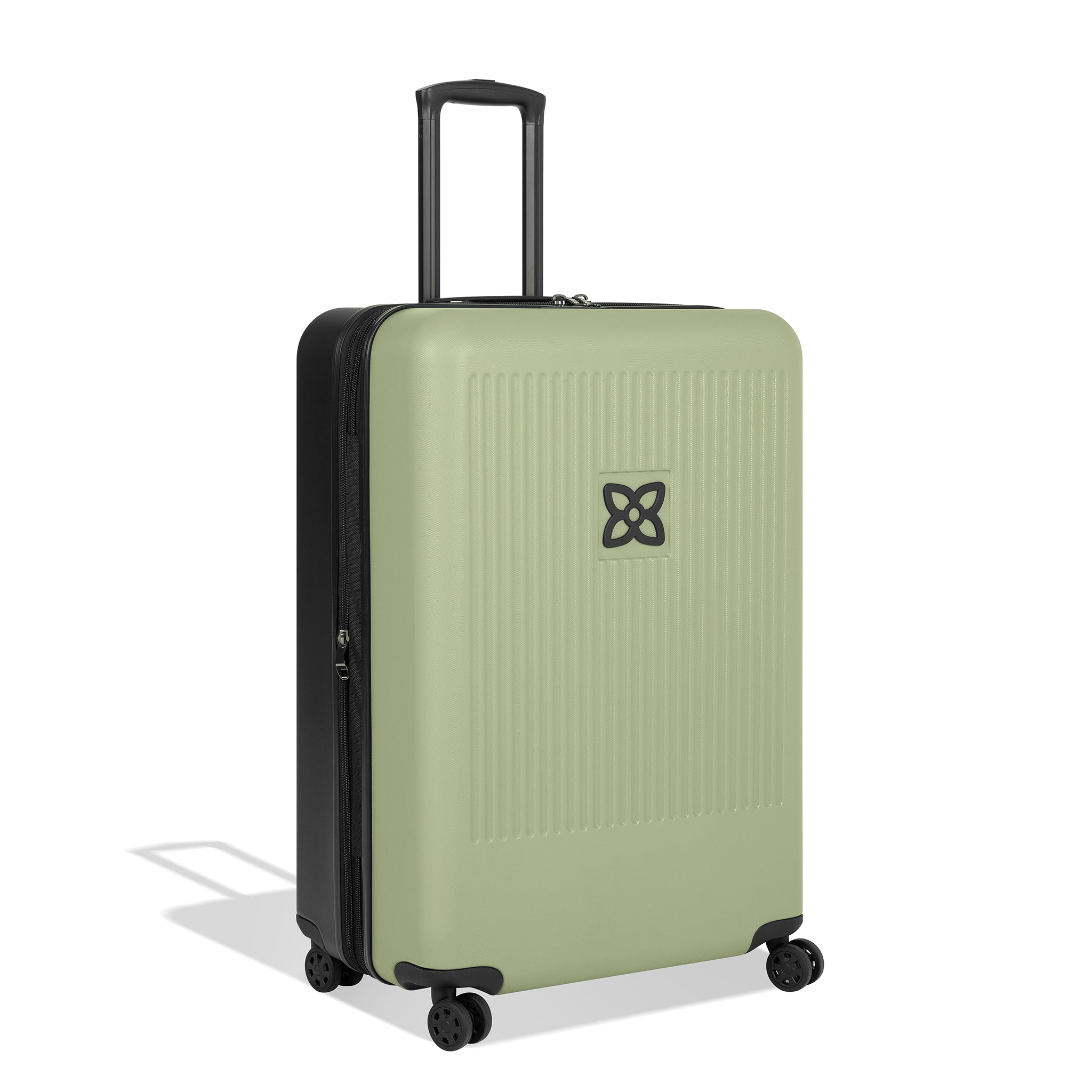 Angled front view of Sherpani hard-shell checked luggage, the Meridian in Sage. Meridian features include a retractable luggage handle, uncrushable exterior, TSA-approved locking zippers and four 36-degree spinner wheels. The Sage color is two-toned with the front of the suitcase in sage green and the back in classic black. 