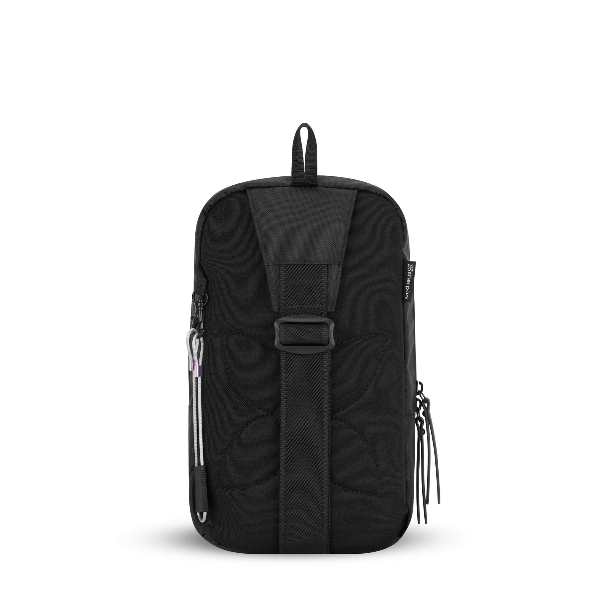Back view of Sherpani mini sling backpack, the Metro. This Anti-Theft travel bag features an adjustable crossbody strap that has multiple attachment points to create a reversible design. 