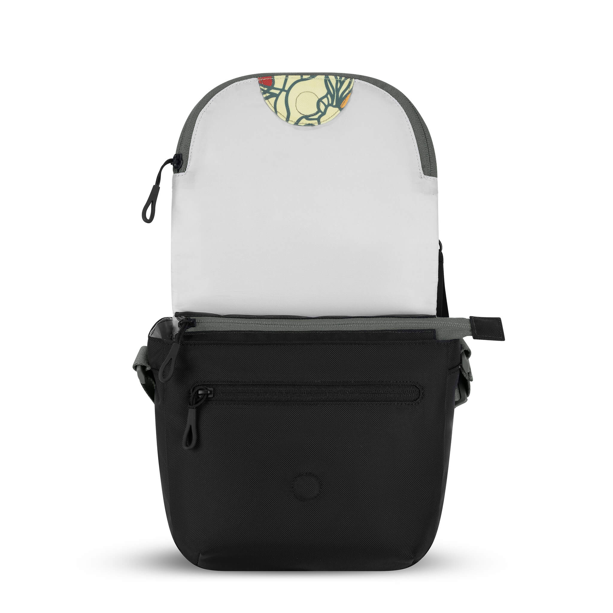 View of Sherpani satchel messenger bag, the Milli in Fiori, with main flap open to reveal a brimmed zipper pocket and magnetic closure. 