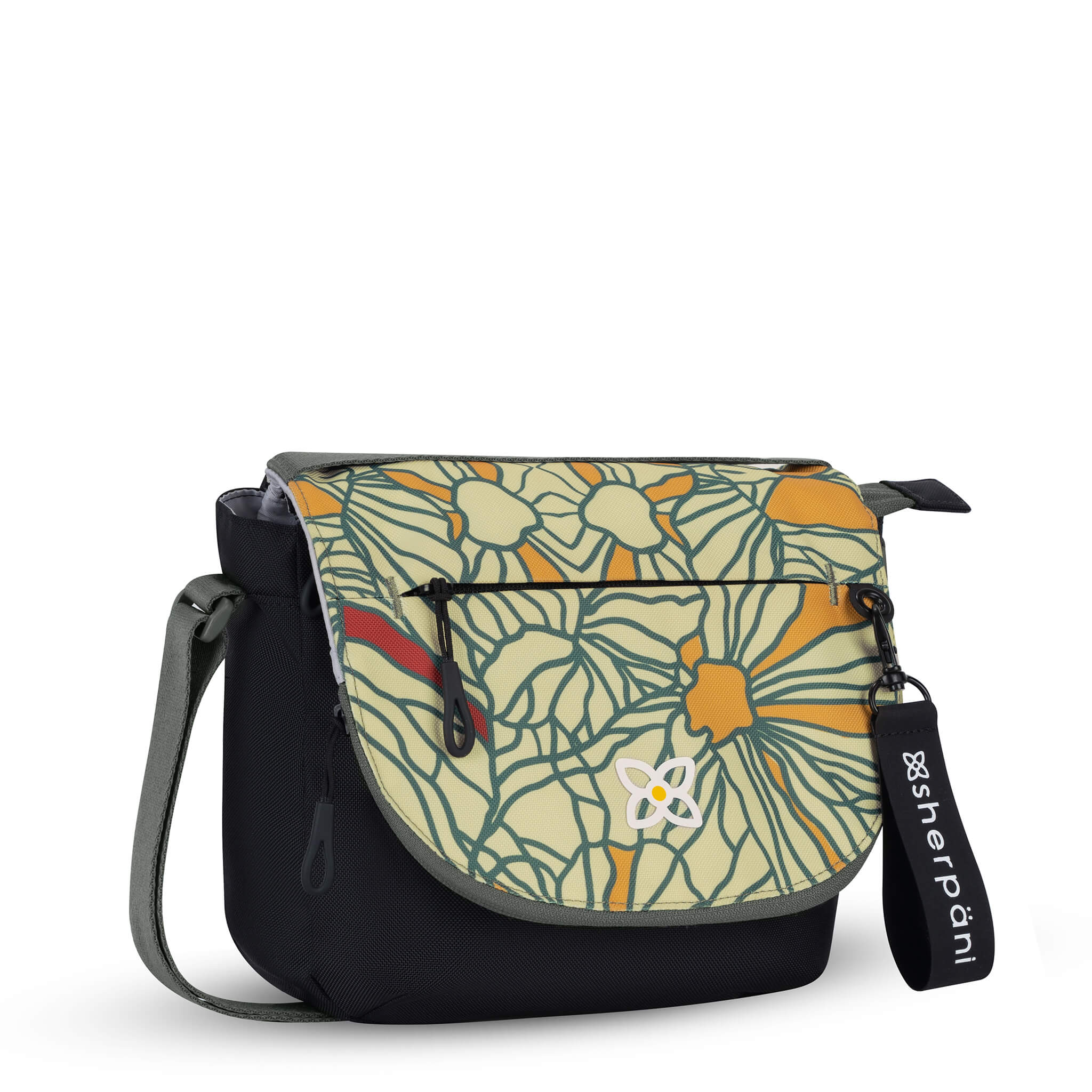 Angled front view of Sherpani messenger satchel bag, the Milli in Fiori. Milli features include an adjustable crossbody strap, front zipper pocket, brimmed zipper pocket, detachable keychain, magnetic closure, RFID security and multiple internal pockets for organization. The Fiori colorway is two-toned in black and a floral pattern with red accents. 