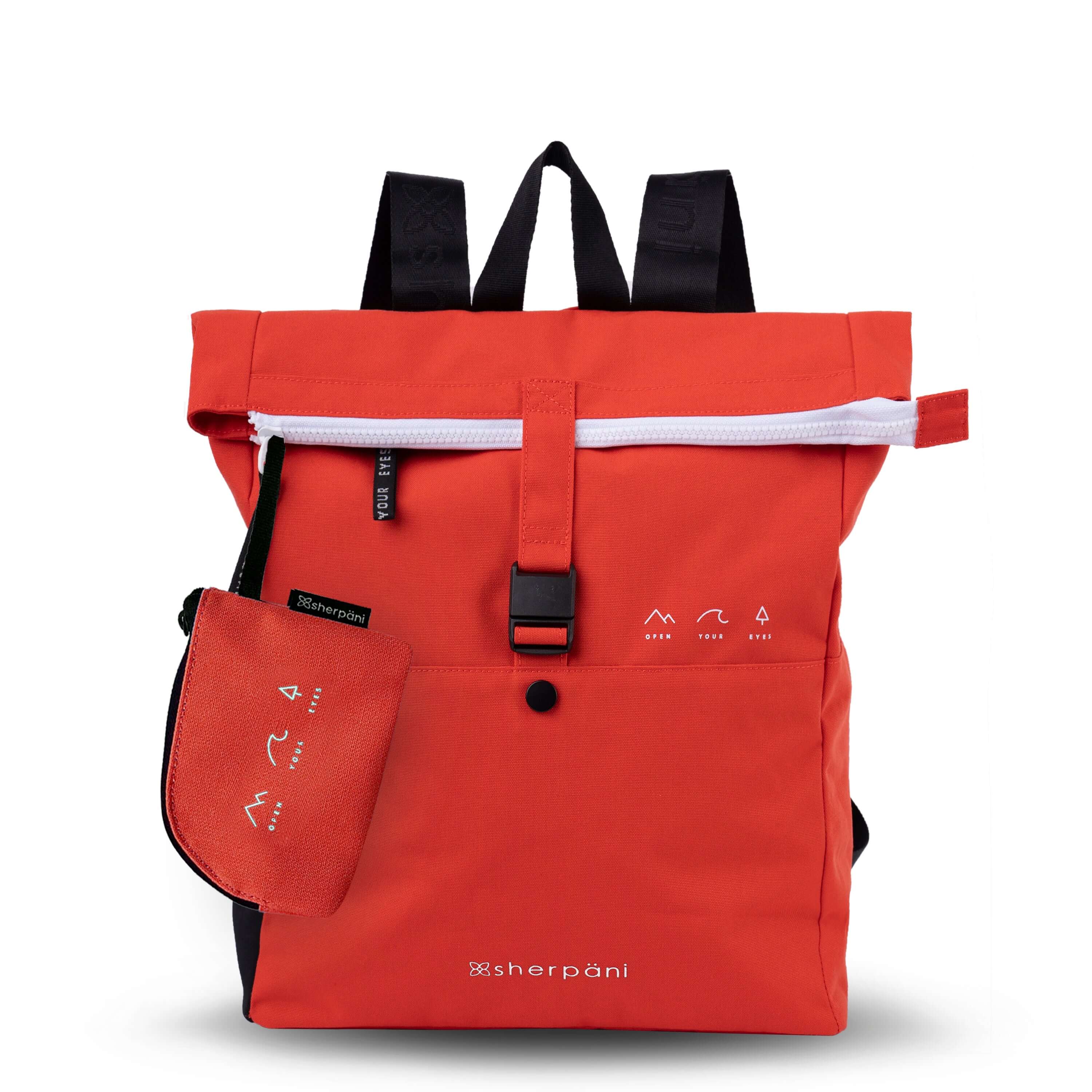 Flat front view of Sherpani backpack, the Miyako in Poppy. The bag is red in color with black accents. It features a magnetic buckle closure, adjustable backpack straps and an external water bottle holder. On the right side are small white graphics that depict mountains, a wave and a pine tree above white text that reads "Open Your Eyes." The bag includes a matching and detachable coin purse.