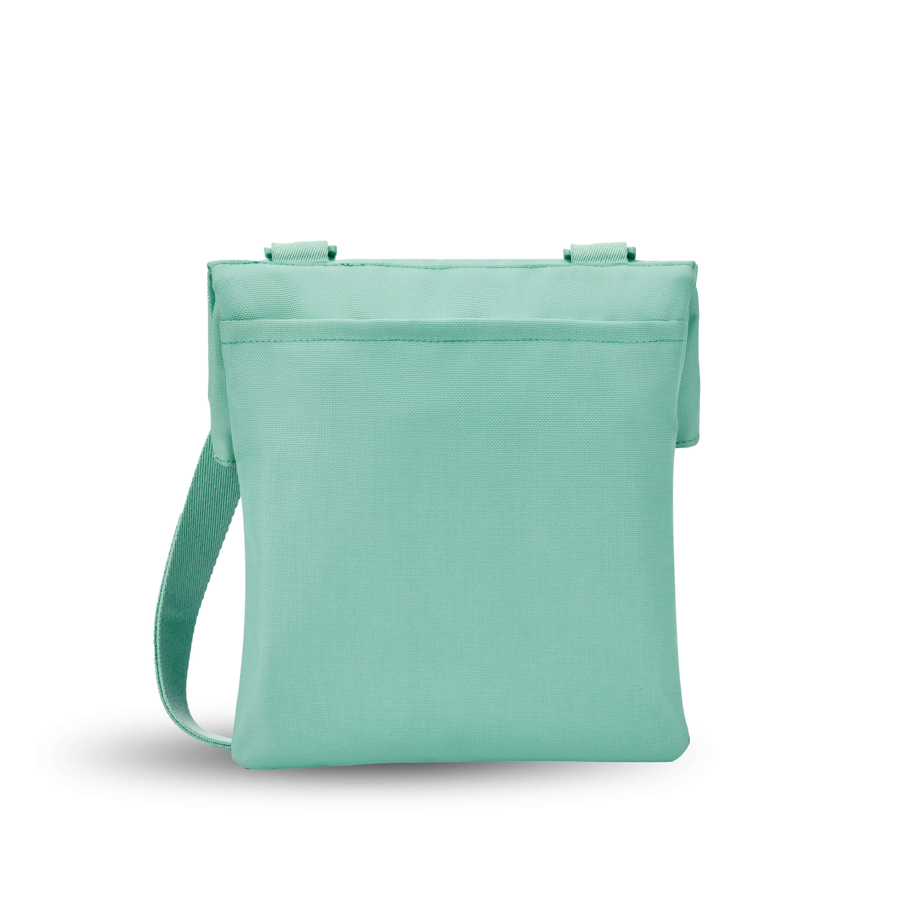 Back view of Sherpani crossbody, the Pica in Seagreen. The back of the bag features an external pouch.