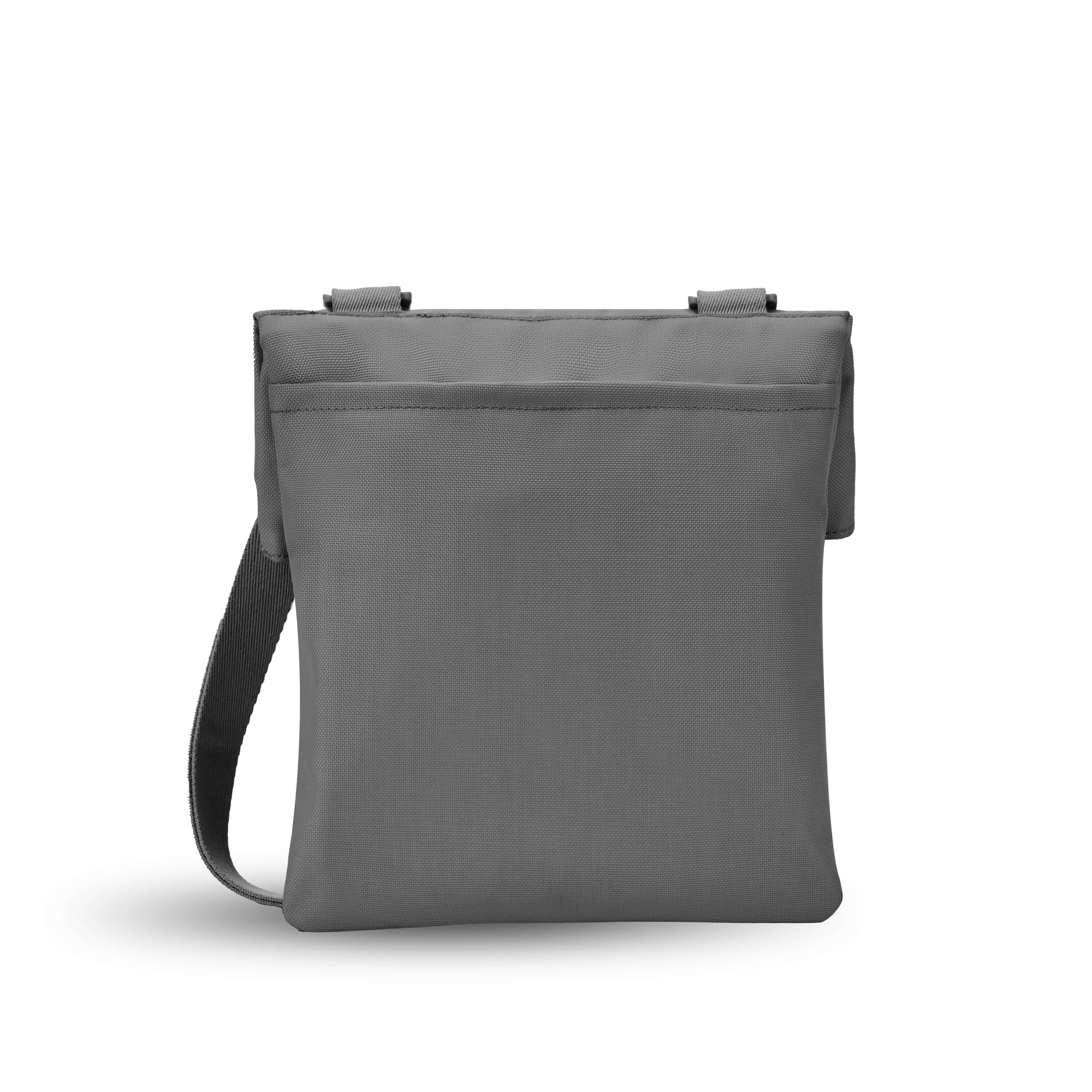 Back view of Sherpani crossbody, the Pica in Stone. The back of the bag features an external pouch.