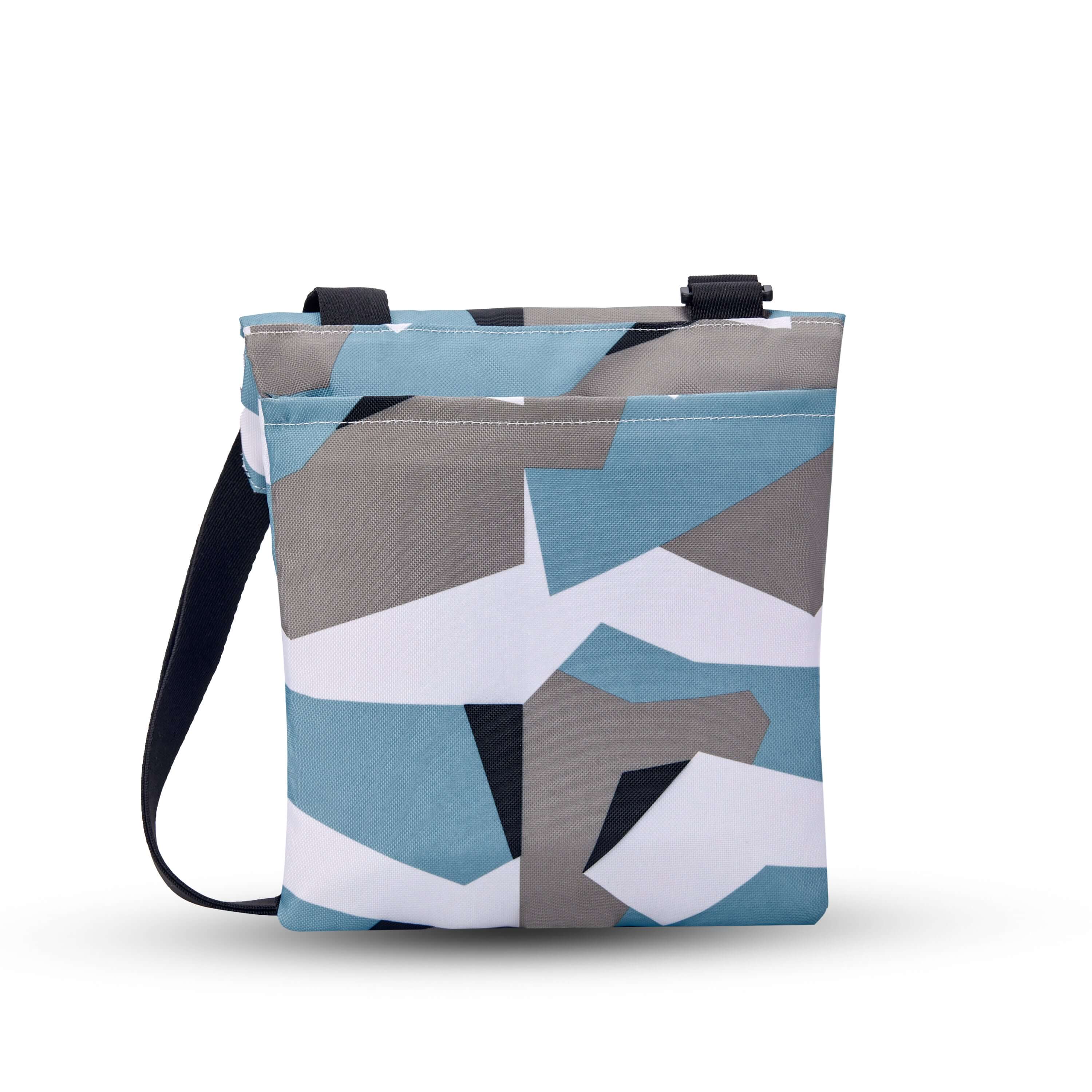 Back view of Sherpani crossbody, the Pica in Summer Camo. The back of the bag features an external pouch. 