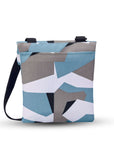 Back view of Sherpani crossbody, the Pica in Summer Camo. The back of the bag features an external pouch.