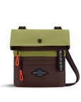 Flat front view of Sherpani crossbody, the Pica in Cactus. The bag is two toned: the top half is green and the bottom half is brown. There is an external zipper pocket on the front panel. Easy-pull zippers are accented in red. The top of the bag folds over creating a signature look. A branded Sherpani keychain is clipped to the upper right corner. The bag has an adjustable crossbody strap.