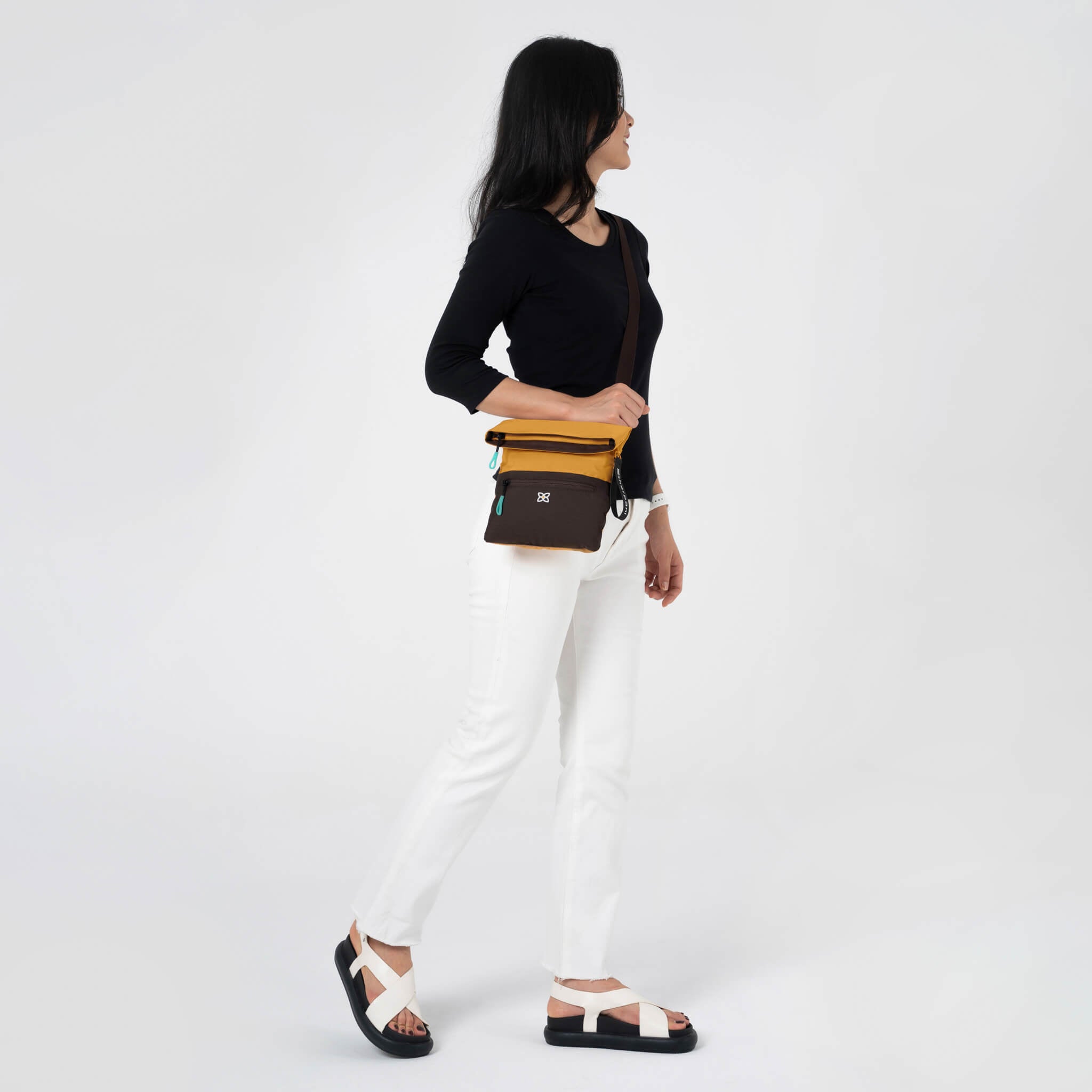 A model wearing Sherpani RFID bag, the Pica in Sundial. 