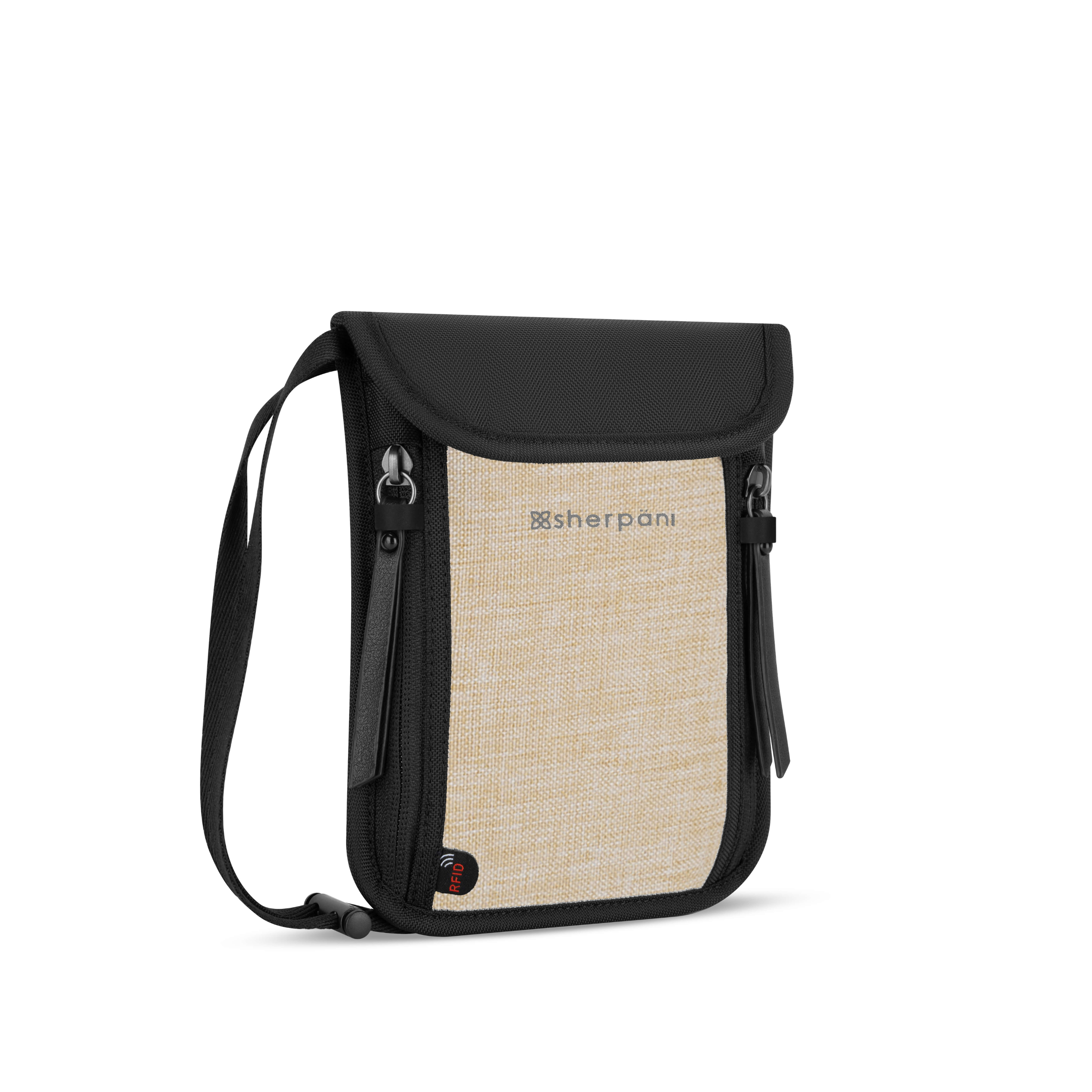Angled front view of the Piper in Straw, anti-theft thin wallet for travel with crossbody strap. 
