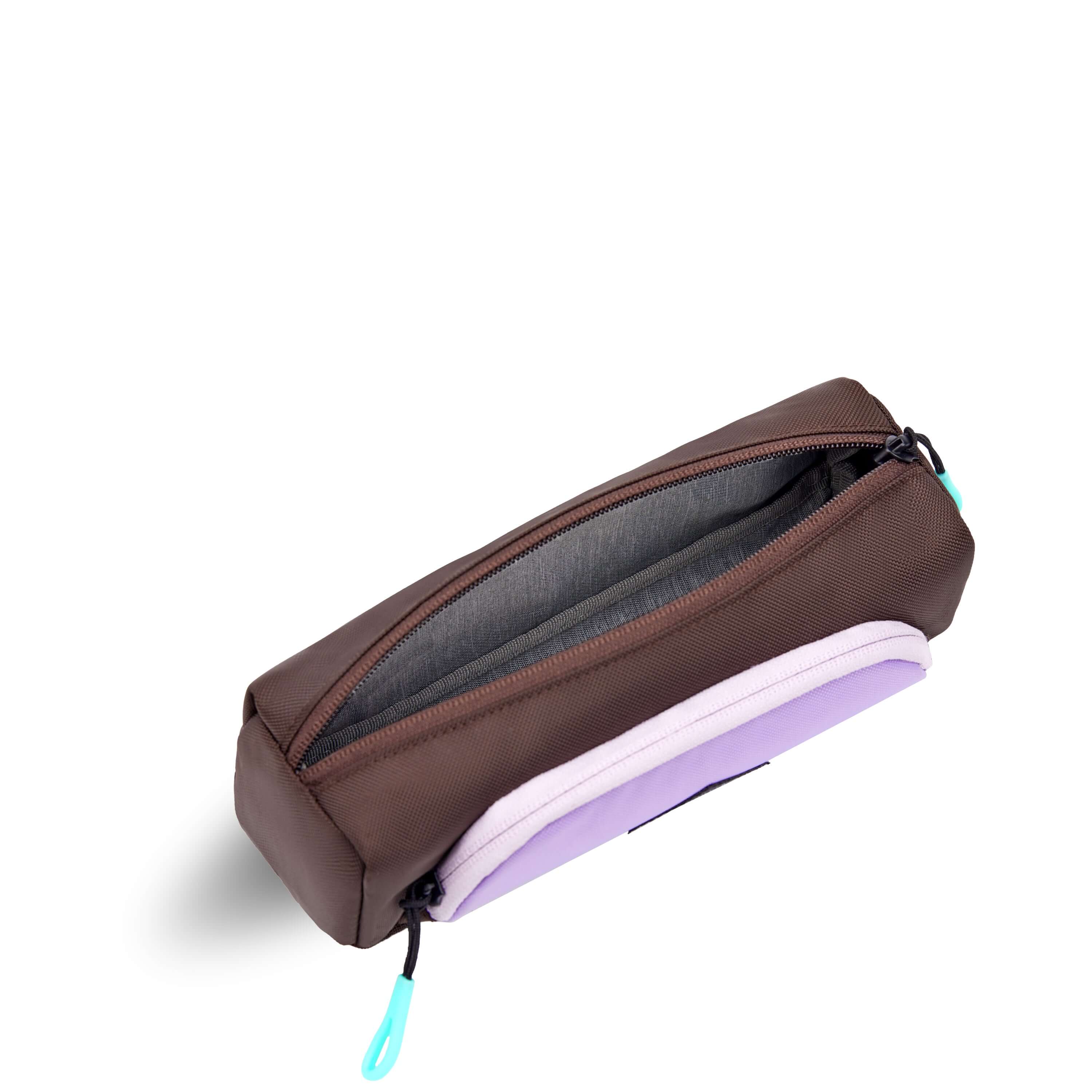 Top view of Sherpani travel accessory, the Poet in Lavender. The pouch is unzipped to reveal a light gray interior.