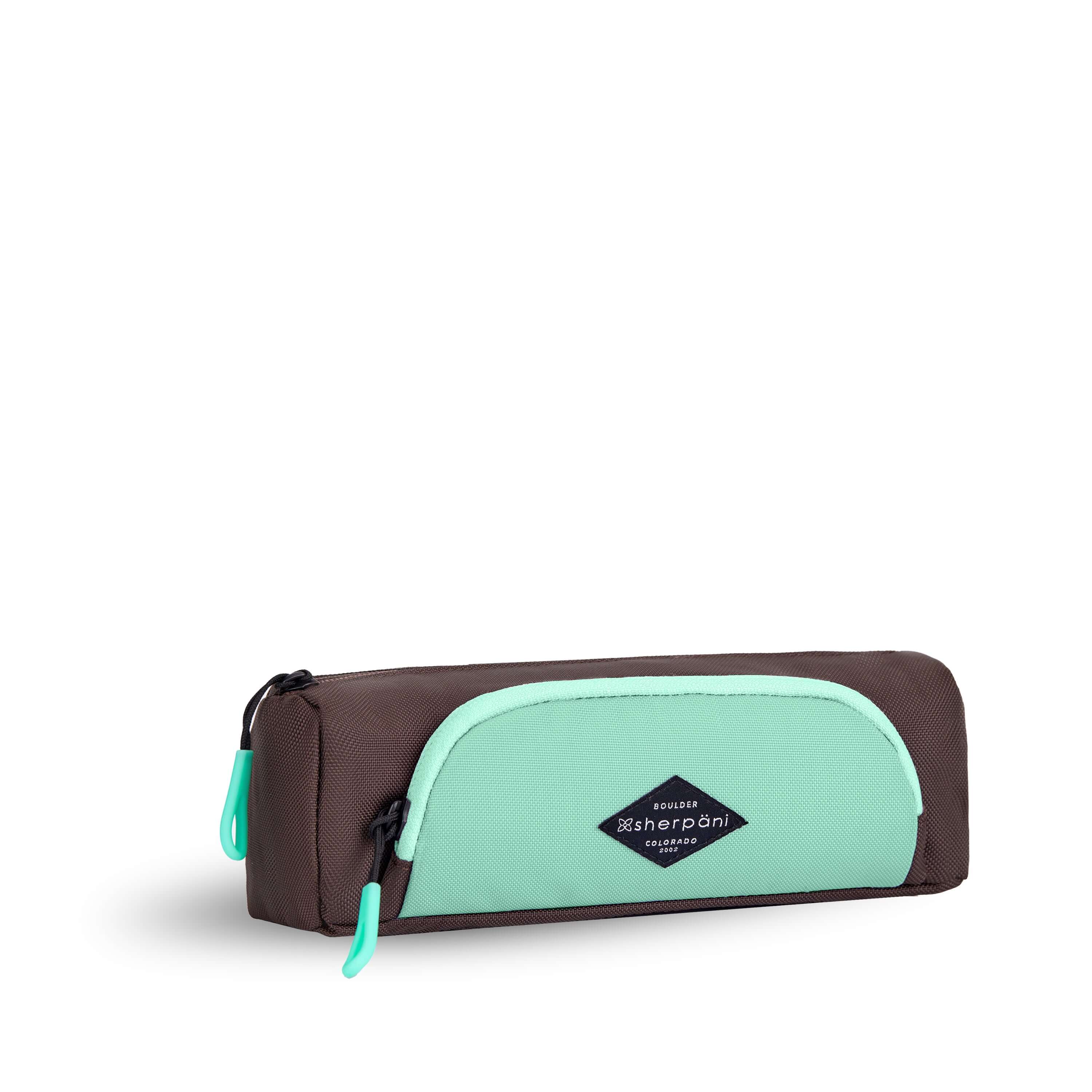 Angled front view of Sherpani travel accessory, the Poet in Seagreen. The pouch is two-toned in light green and brown. There is an external zipper pocket on the front. Easy-pull zippers are accented in light green. #color_seagreen