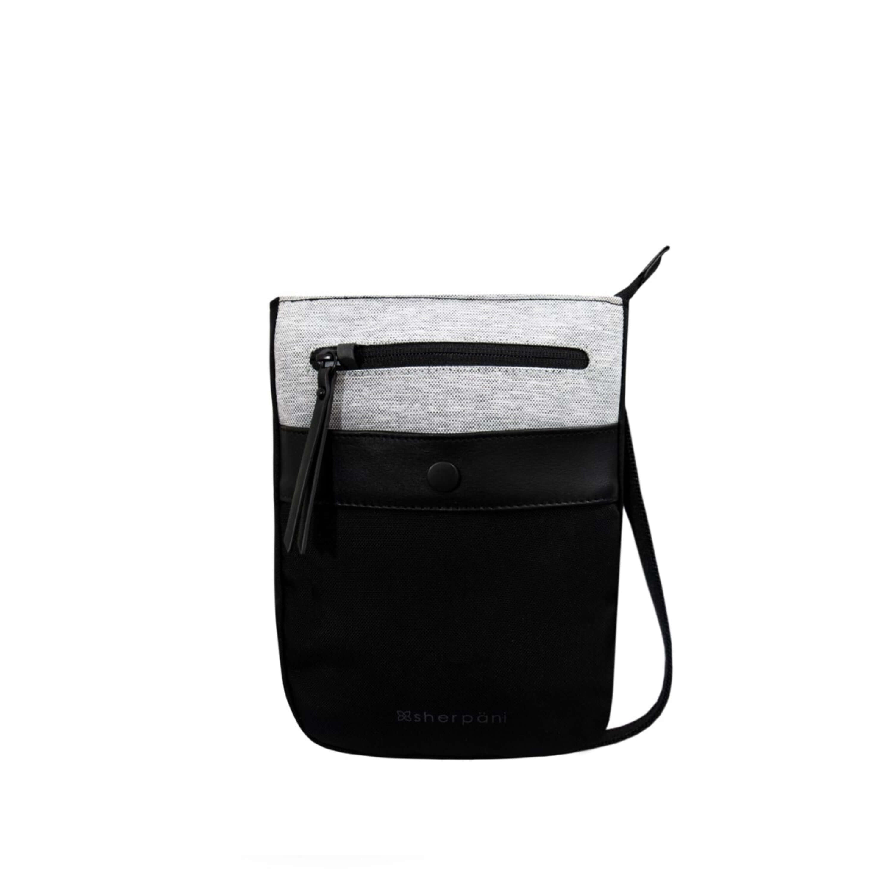 Flat front view of Sherpani’s Anti-Theft bag, the Prima AT in Sterling, with vegan leather accents in black. There is an external pouch on the front of the bag that sits below a locking zipper compartment. The bag features an adjustable crossbody strap. 
