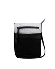  Flat front view of Sherpani’s Anti-Theft bag, the Prima AT in Sterling, with vegan leather accents in black. There is an external pouch on the front of the bag that sits below a locking zipper compartment. The bag features an adjustable crossbody strap.