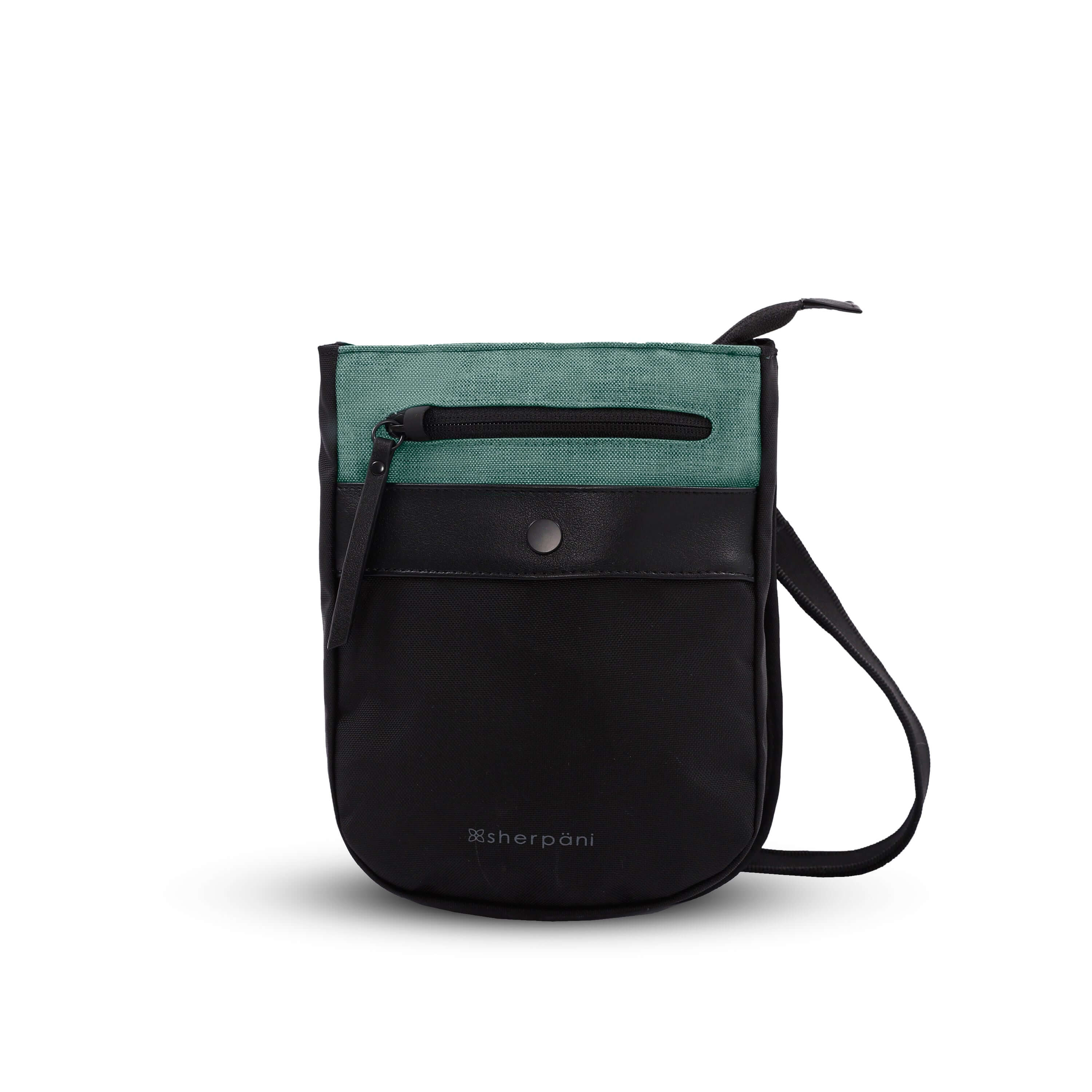 Flat front view of Sherpani’s Anti-Theft bag, the Prima AT in Teal, with vegan leather accents in black. There is an external pouch on the front of the bag that sits below a locking zipper compartment. The bag features an adjustable crossbody strap. 