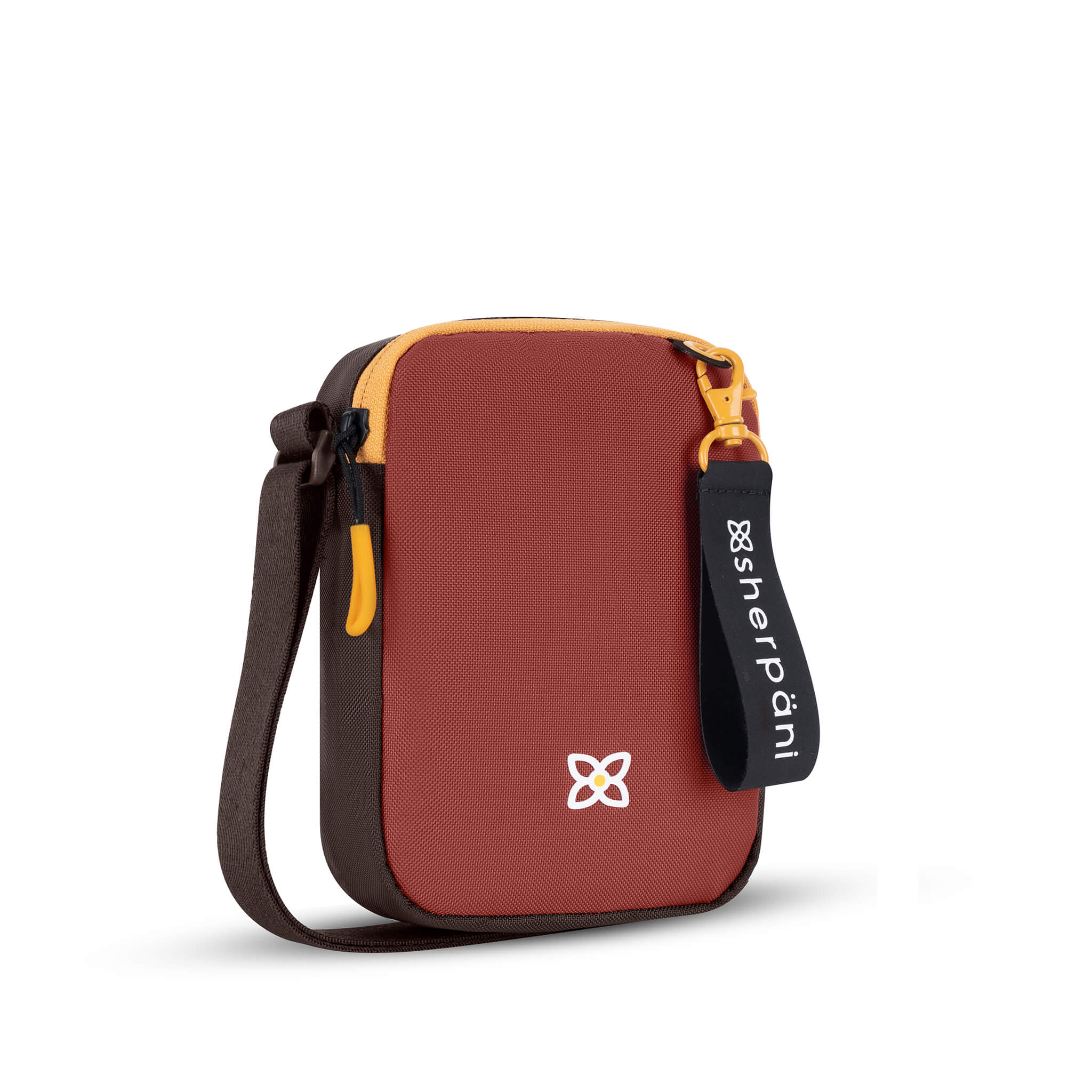 Angled front view of Sherpani mini crossbody purse, the Rogue in Cider. Rogue features include an adjustable crossbody strap, detachable keychain, compact design, minimalist bag and RFID protection. The Cider color is two-toned in burgundy and dark brown with yellow accents.