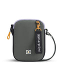 Flat front view of Sherpani mini crossbody purse, the Rogue in Juniper. Rogue features include an adjustable crossbody strap, detachable keychain, compact design, minimalist bag, RFID protection and back slip pocket. The Juniper color is two-toned in black and gray with yellow accents.