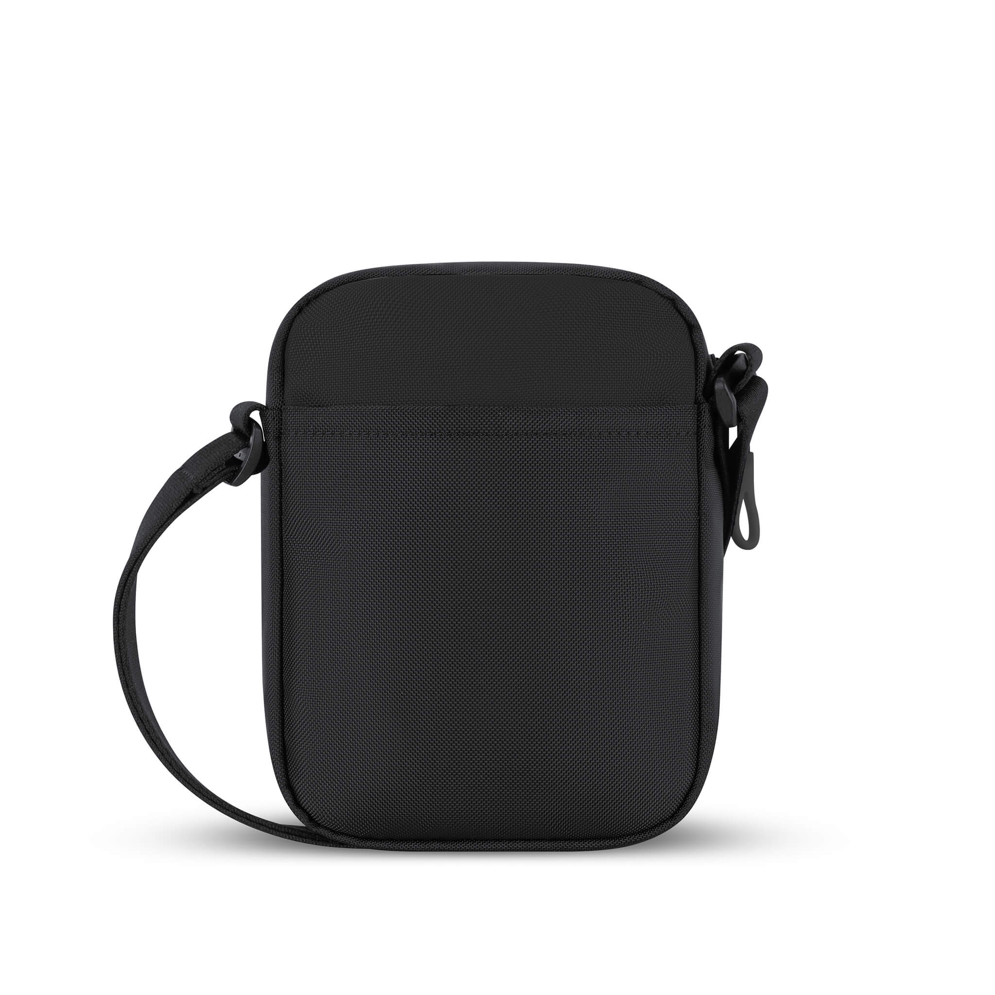 Back view of Sherpani mini crossbody purse, the Rogue in Raven. Rogue features include an adjustable crossbody strap, detachable keychain, compact design, minimalist bag, RFID protection and back slip pocket. The Raven color is true black with Sherpani edelweiss logo accented in white.