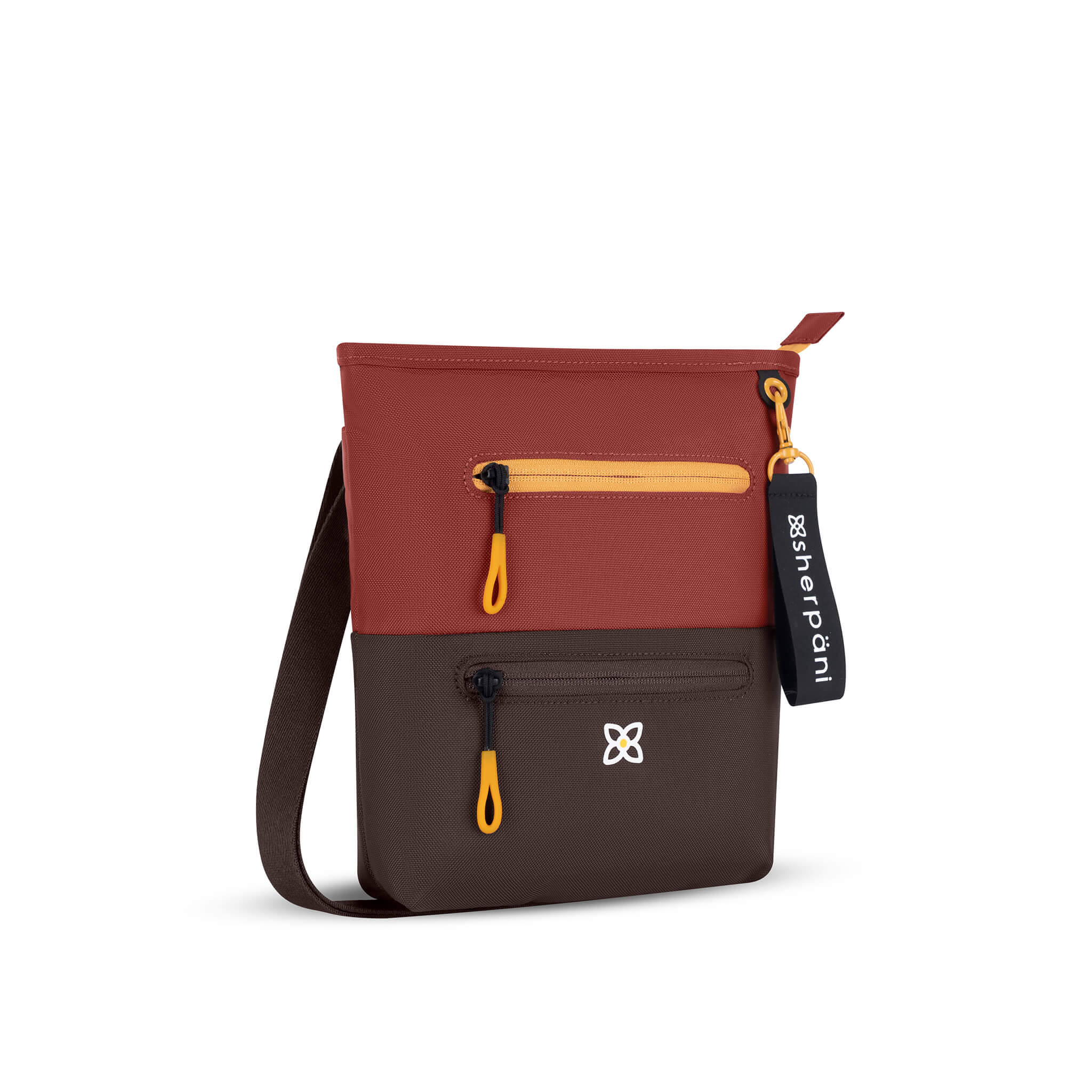 Angled front view of Sherpani crossbody travel bag, the Sadie in Cider. Sadie features include two front zipper pockets, a discrete side pocket, detachable keychain, adjustable crossbody strap, back slip pocket and RFID blocking technology. The Cider color is two-toned in burgundy and dark brown with yellow accents. 