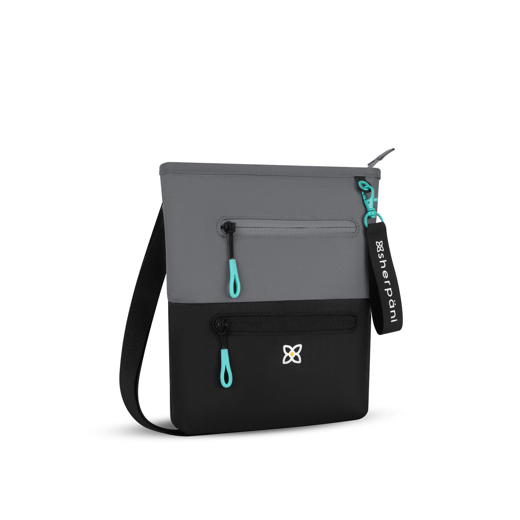 Angled front view of Sherpani crossbody travel bag, the Sadie in Moonstone. Sadie features include two front zipper pockets, a discrete side pocket, detachable keychain, adjustable crossbody strap, back slip pocket and RFID blocking technology. The Moonstone color is two-toned in gray and black with turquoise accents.