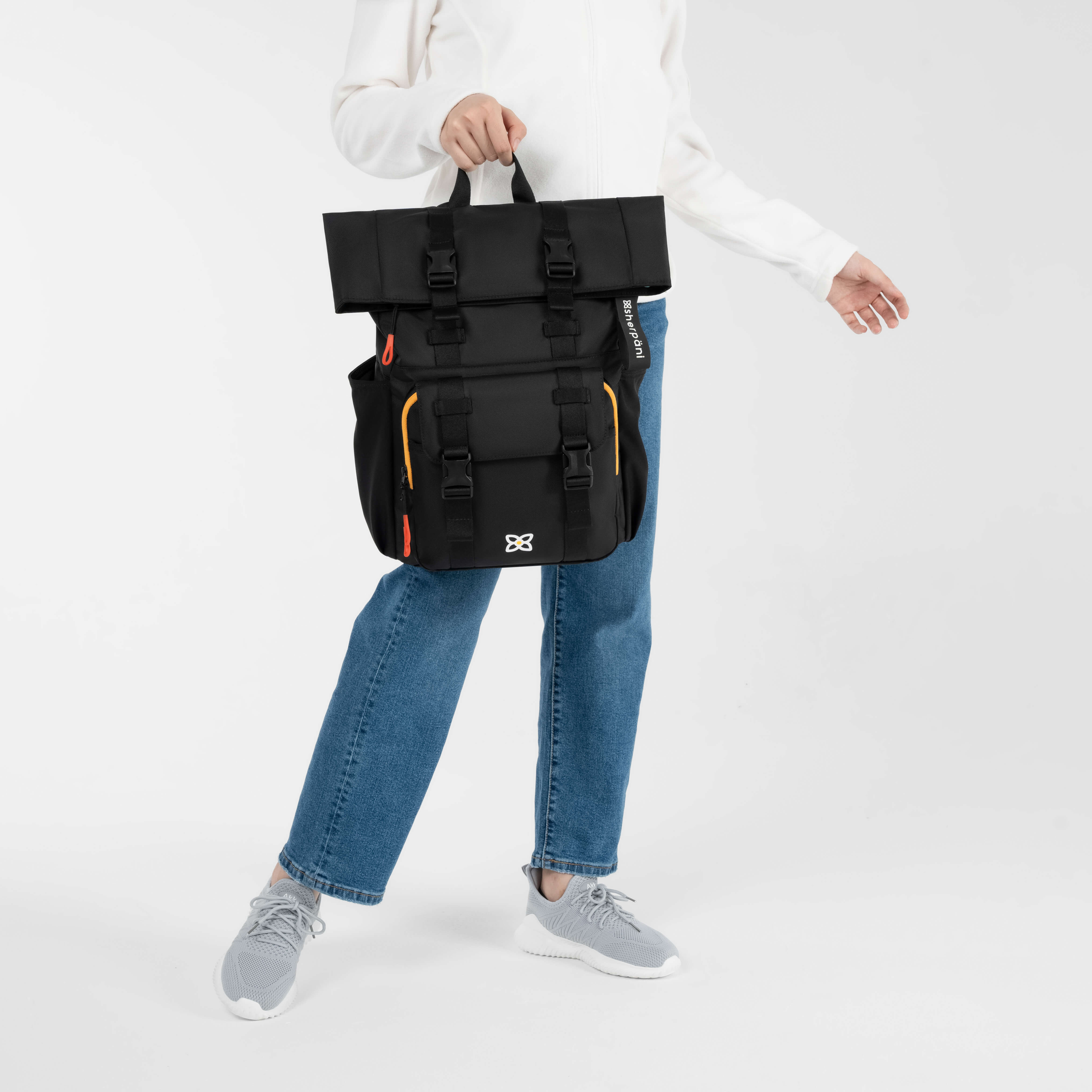 A model holding up the Sedona in Chromatic by the carrying handle. 