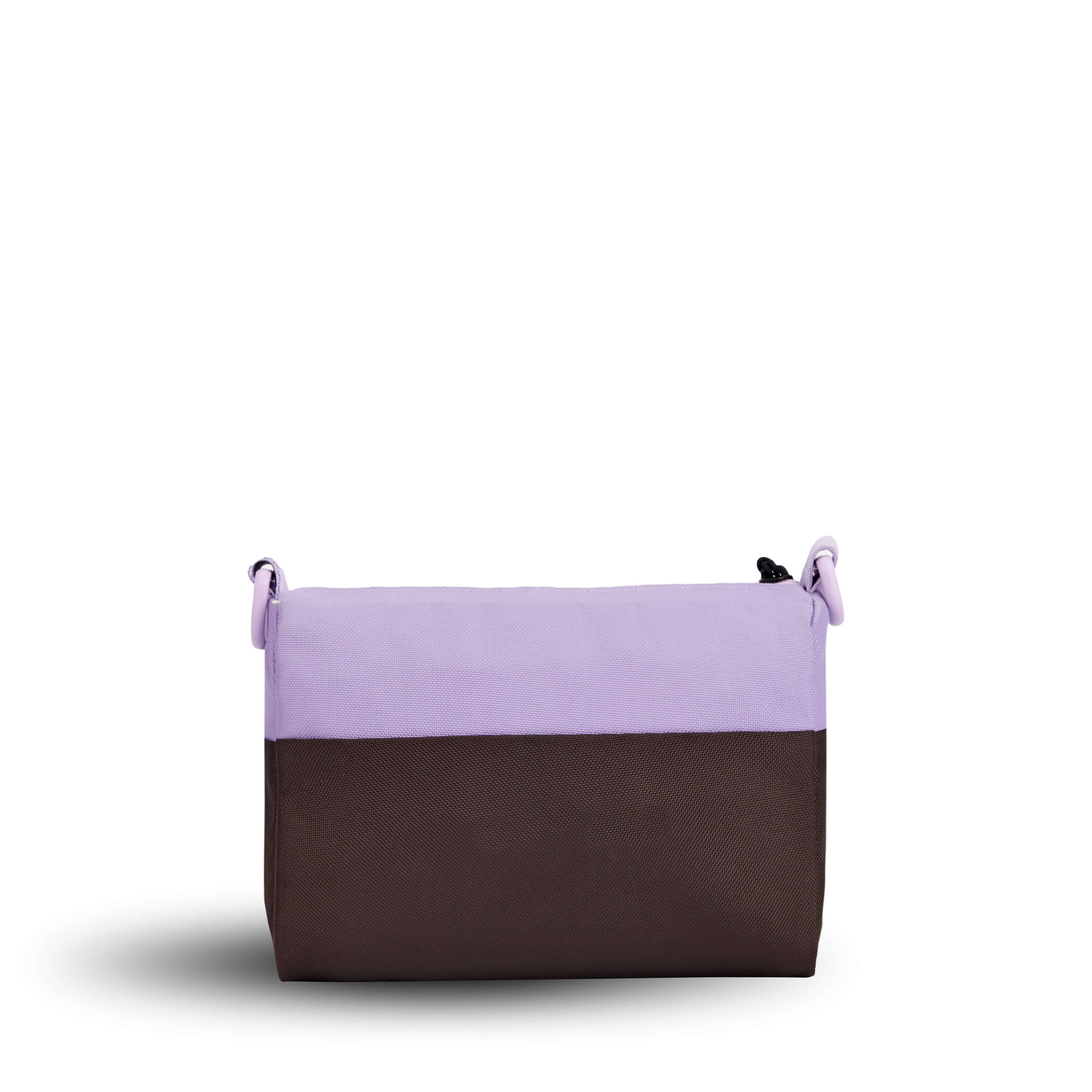 Back view of Sherpani's purse, the Skye in Lavender. It is two-toned, the top half of the bag is lavender and the bottom half of the bag is brown. 
