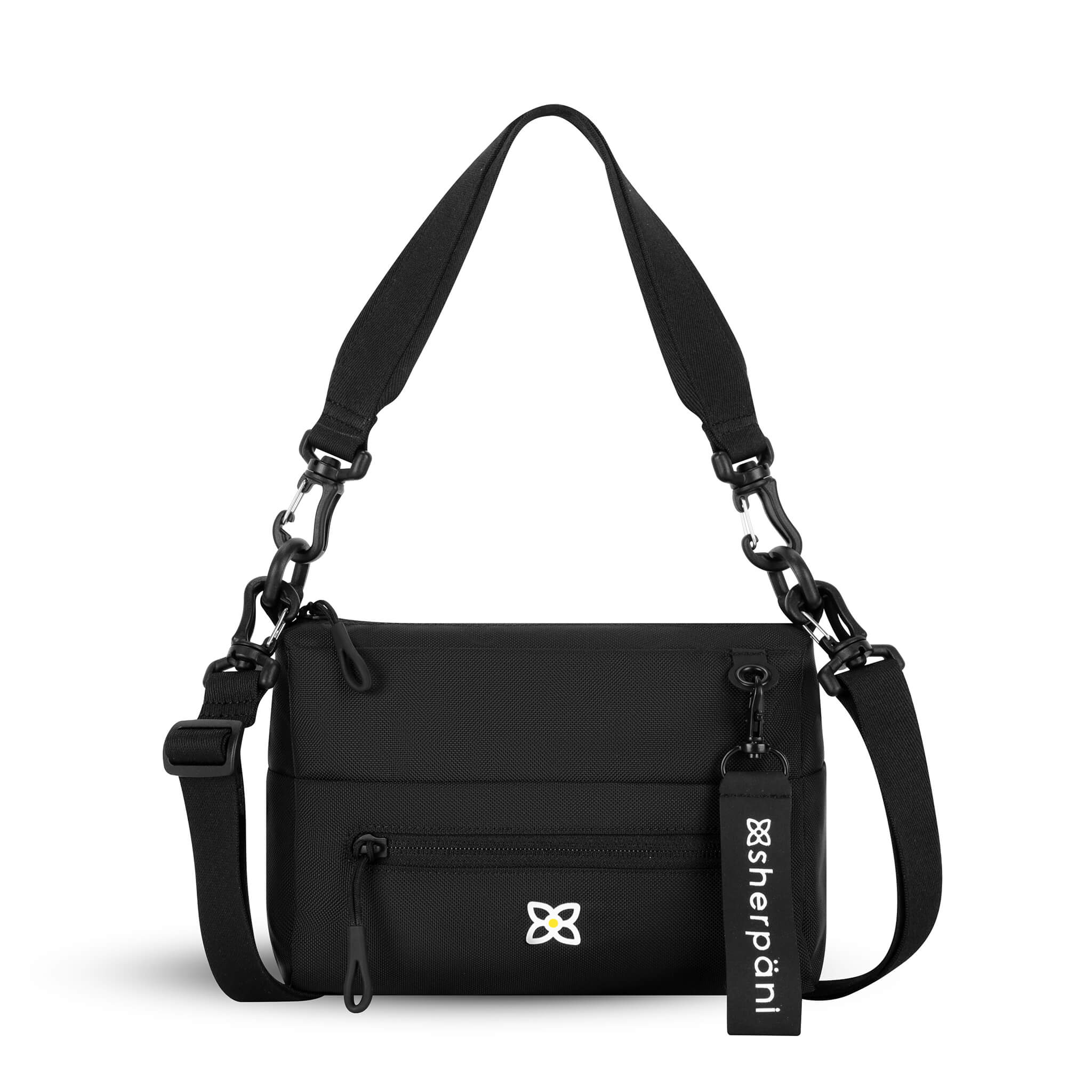 Flat front view of Sherpani mini shoulder bag, the Skye in Raven. Skye features include RFID security, detachable keychain, outside zipper pocket, two inside zipper pockets and two removable straps: a short shoulder strap and a longer adjustable crossbody strap. The Raven color is solid black with Sherpani logo (edelweiss flower) as a white accent.