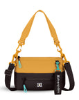 Flat front view of Sherpani mini shoulder bag, the Skye in Sundial. Skye features include RFID security, detachable keychain, outside zipper pocket, two inside zipper pockets and two removable straps: a short shoulder strap and a longer adjustable crossbody strap. The Sundial color is two-toned in yellow and dark brown with turquoise accents.
