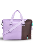 Back view of Sherpani bag, the Sola in Lavender. The bag is two-toned in lavender and brown. Easy-pull zippers are accented in aqua. The bag has tote handles and an adjustable/detachable crossbody strap.