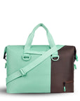 Back view of Sherpani bag, the Sola in Seagreen. The bag is two-toned in light green and brown. Easy-pull zippers are accented in light green. The bag has tote handles and an adjustable/detachable crossbody strap.