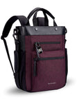 Angled front view of Sherpani's Anti-Theft bag, the Soleil AT in Merlot, with vegan leather accents in black. On the front are two locking zipper compartments, a ReturnMe tag is clipped to the upper one. Two elastic water bottle holders sit on either side of the bag. It has padded backpack straps, short tote handles, and an adjustable/detachable crossbody strap.