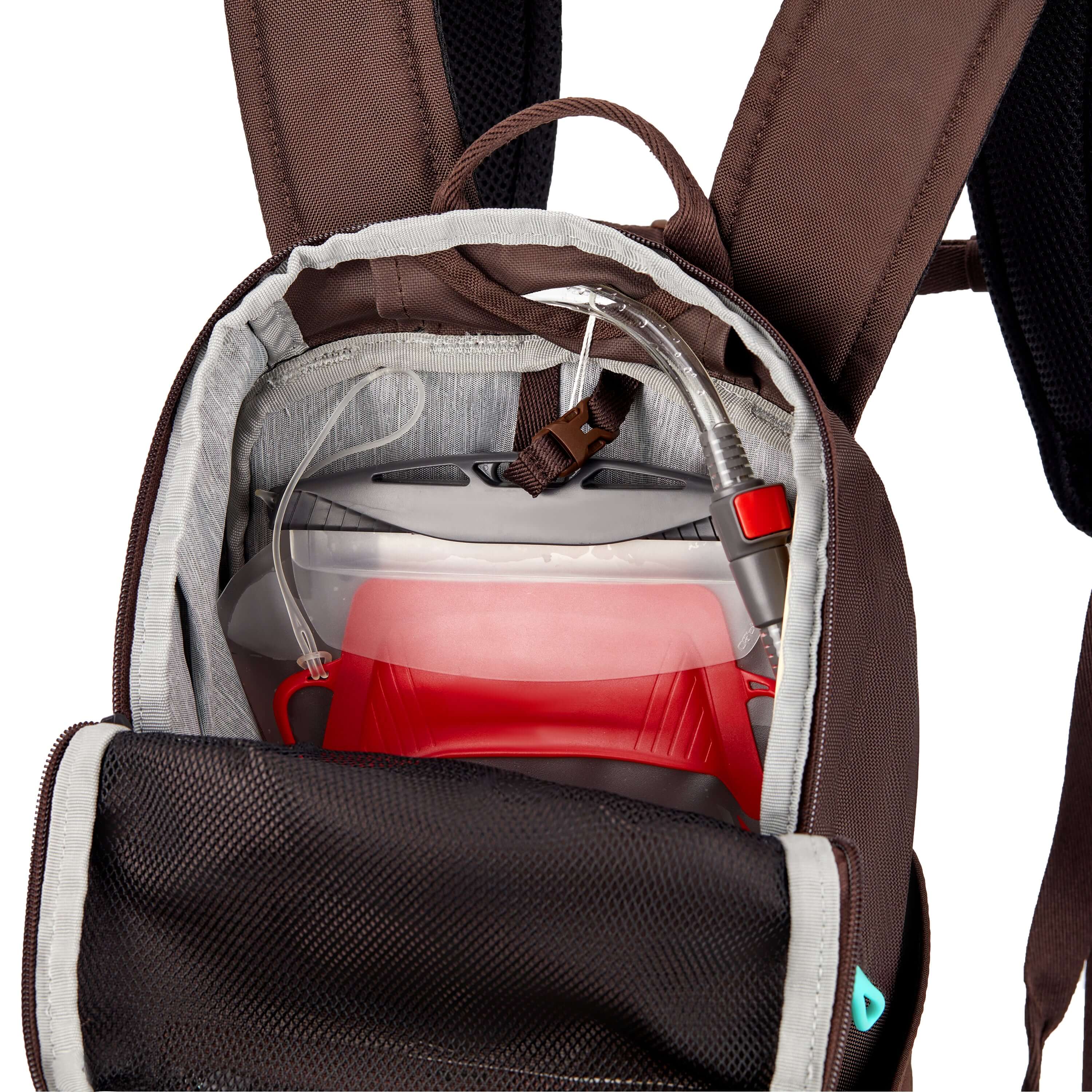 Inside view of Sherpani backpack, the Switch in Lavender. The main zipper compartment is open to reveal a light gray interior and an internal hydration reservoir sleeve. 
