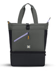 Flat front view of Sherpani backpack/tote combo the Terra in Juniper. The bag is two-toned in gray and black with accents in lavender and yellow. There is a buckle clasp at the top, an elastic water bottle holder on each side, an external zipper pocket on the front, and a cooler compartment for food storage at the bottom.