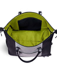 Top view of Sherpani’s Anti-Theft rolling duffle the Trip in Sterling. The main zipper compartment is open showcasing a wide mouth and revealing a lime green interior with an internal zipper pocket.