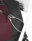 Close up view of the chair loop lock system securing Sherpani's Anti-Theft rolling duffle, the Trip in Merlot, to a chair.
