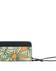 Back view of Sherpani wallet with RFID protection, the Tulum in Fiori. The Tulum is the ideal travel wallet that will organize and protect sensitive information and includes a wristlet strap for easy carrying. The Fiori colorway is a floral pattern with a neutral color palette.