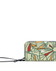 Flat front view of Sherpani wallet with RFID protection, the Tulum in Fiori. The Tulum is the ideal travel wallet that will organize and protect sensitive information and includes a wristlet strap for easy carrying. The Fiori colorway is a floral pattern with a neutral color palette.