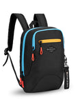 Angled front view of Sherpani mini backpack, the Vespa in Chromatic. The bag is mostly black and has accents in yellow and blue. It features easy-pull zippers accented in red. It has padded and adjustable backpack straps, as well as a tote handle for easy carrying. The bag has a main zipper compartment, a smaller secondary zipper compartment and an external zipper pocket on the front. A branded Sherpani keychain is clipped to a fabric loop on the front of the bag.