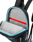 Top view of Sherpani mini backpack, the Vespa in Chromatic. The main zipper compartment is open to reveal a light gray interior and internal zipper pocket.