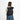 Woman wearing a Sherpani Sedona Raven Black Backpack on her back against white background. #color_raven-black