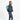Woman wearing a Sherpani Sedona Surf Blue  Backpack on her back against white background. #color_surf-blue