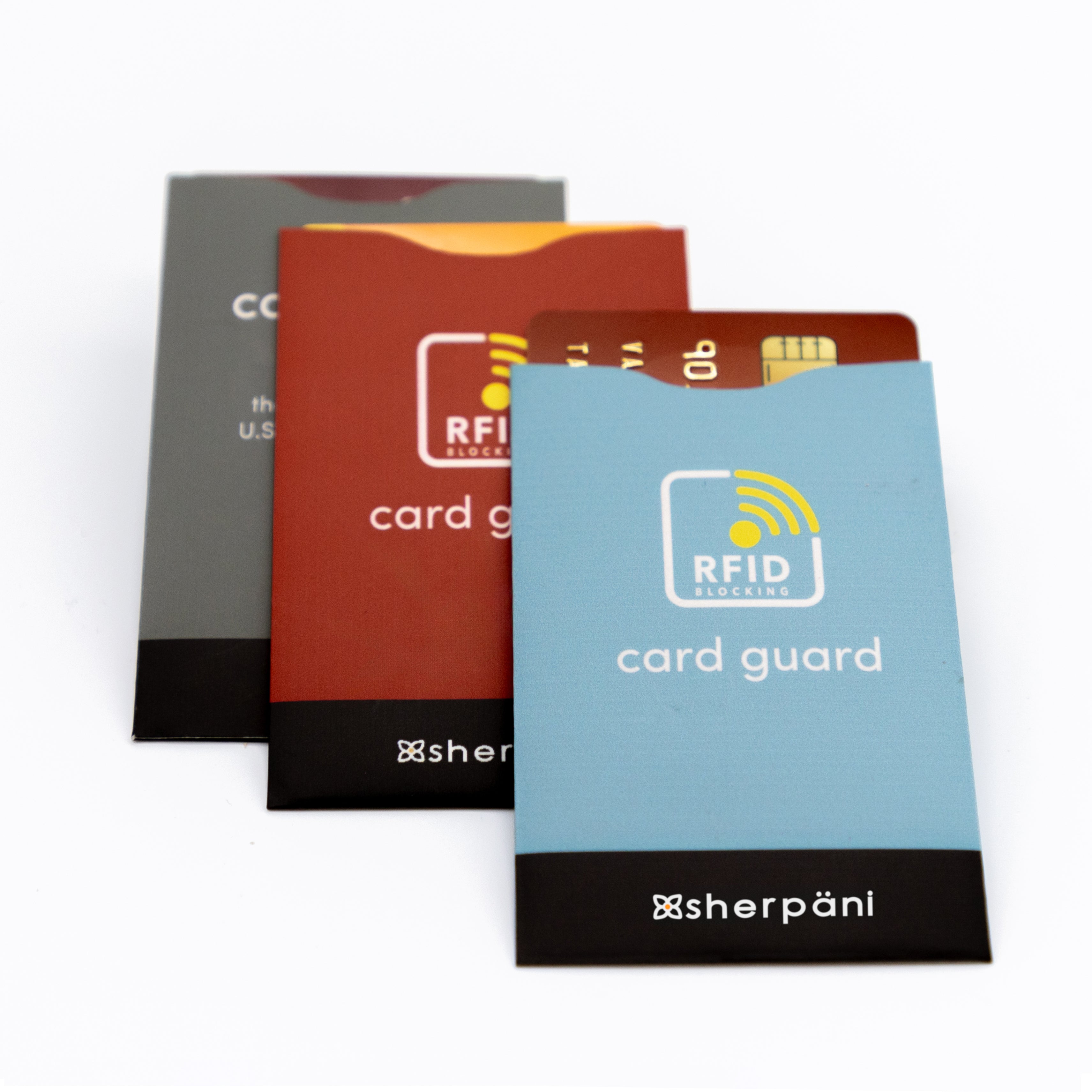 Sherpani set of three card guards with built-in RFID security. Each individual credit card sleeve is a different color: Maui Blue, Cider and Juniper.