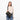 A woman wearing a Sherpani Ceara Chromatic Black Expandable Crossbody on her shoulder against a white background.   #color_chromatic-black